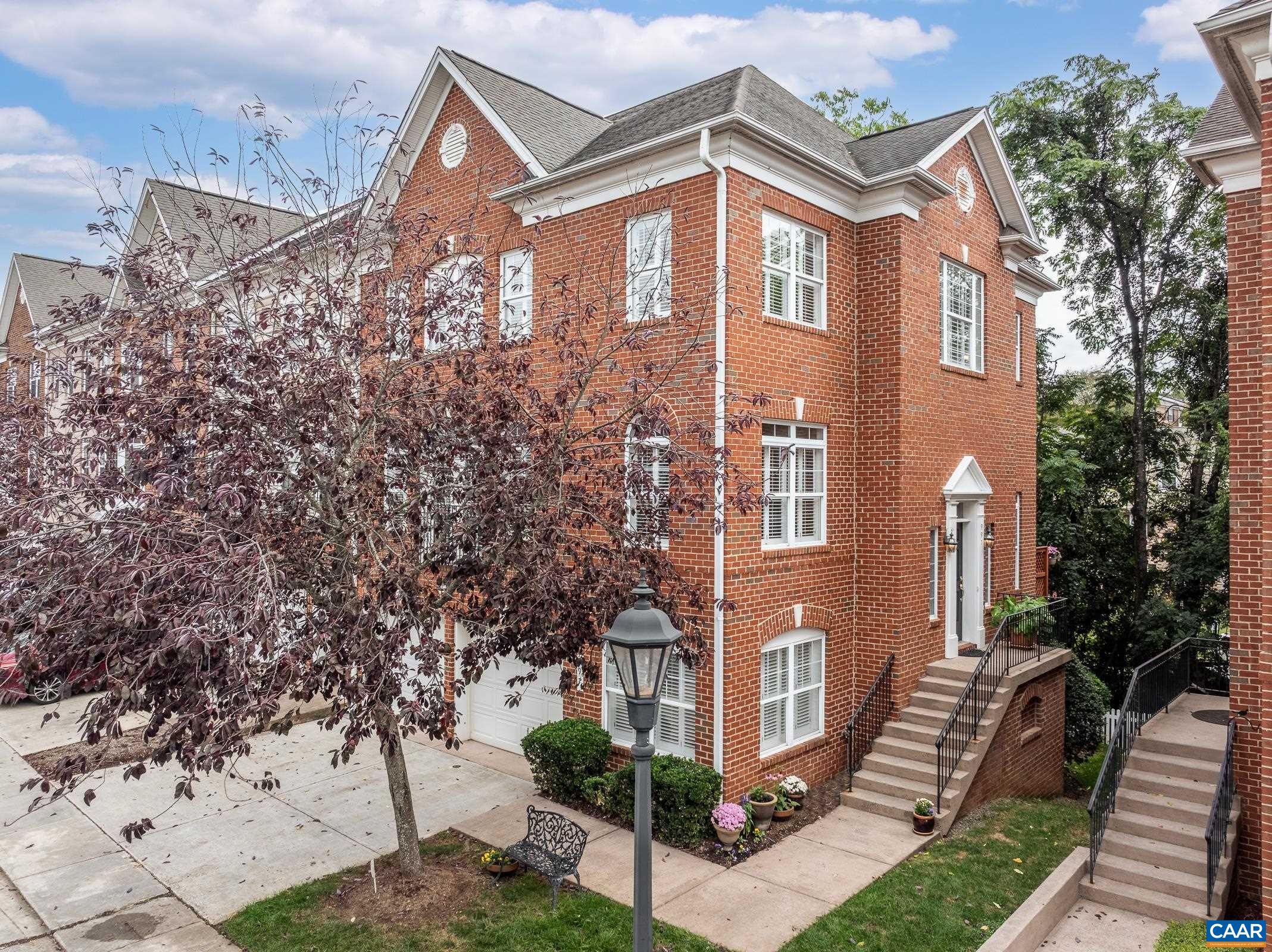 Experience luxury townhome living at its finest in this stunning, all-brick Glenwood Station end unit. Flooded with natural light thanks to abundant windows and soaring high ceilings, the home features gleaming hardwood floors, including in all upper bedrooms, gas fireplace in the family room, and fantastic home office for today's lifestyle. The heart of the home is a gorgeous, well-appointed kitchen, perfect for preparing meals and entertaining. Relaxation awaits in the very spacious and luxurious primary suite, which includes two large walk-in closets and a sumptuous, spa-like primary bath. Additional features include a large two-car garage for easy parking and storage. Situated in a great neighborhood just moments from downtown Cville, this home offers convenient access to everything around town. Beyond your front door, indulge in fantastic neighborhood amenities, including a 24-hour gym and a beautiful pool for recreation. This meticulously maintained property offers the perfect blend of luxury, convenience, and community. Be sure to see the extensive features and improvements document!