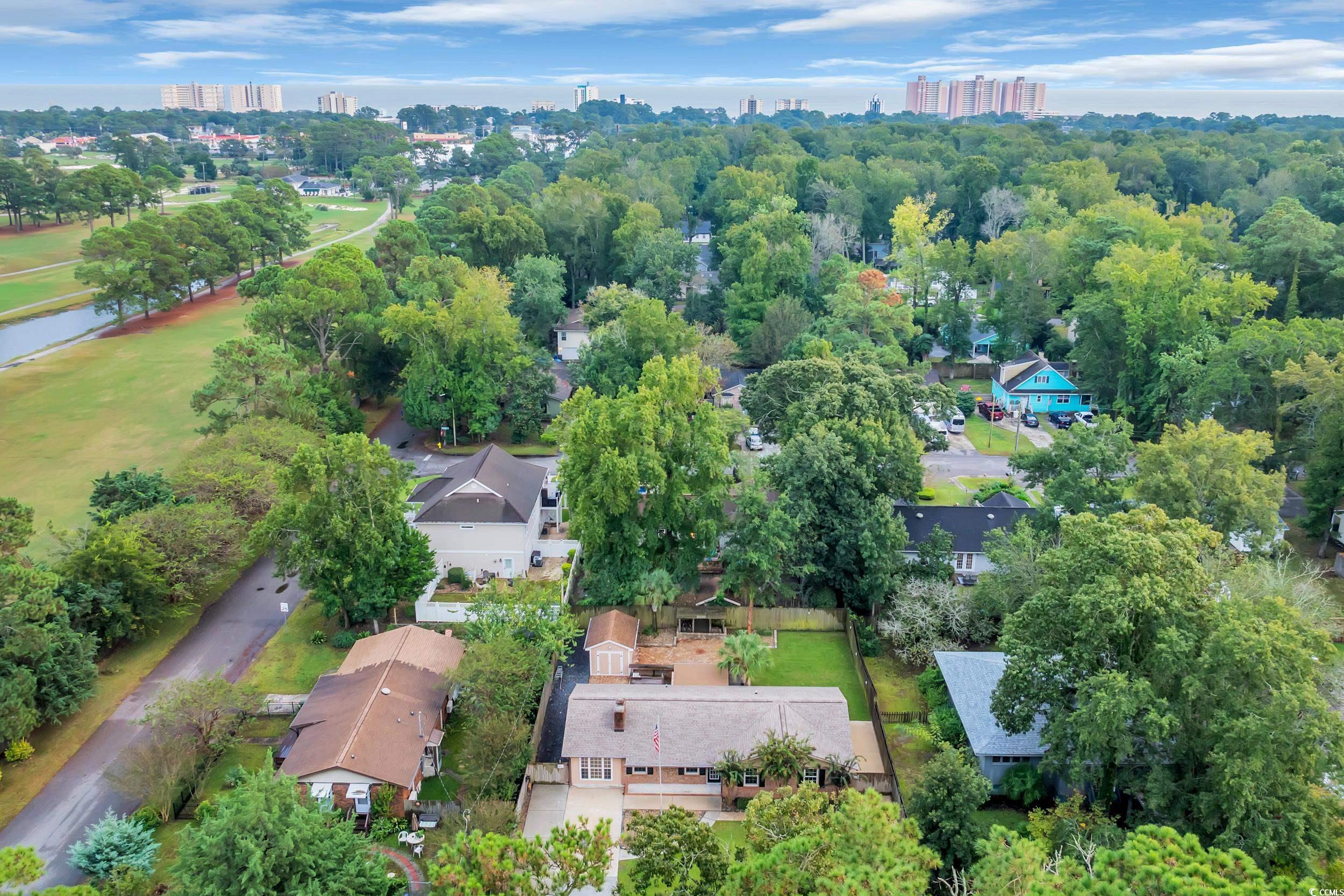 View of property location featuring a large body of water and nearby urban area