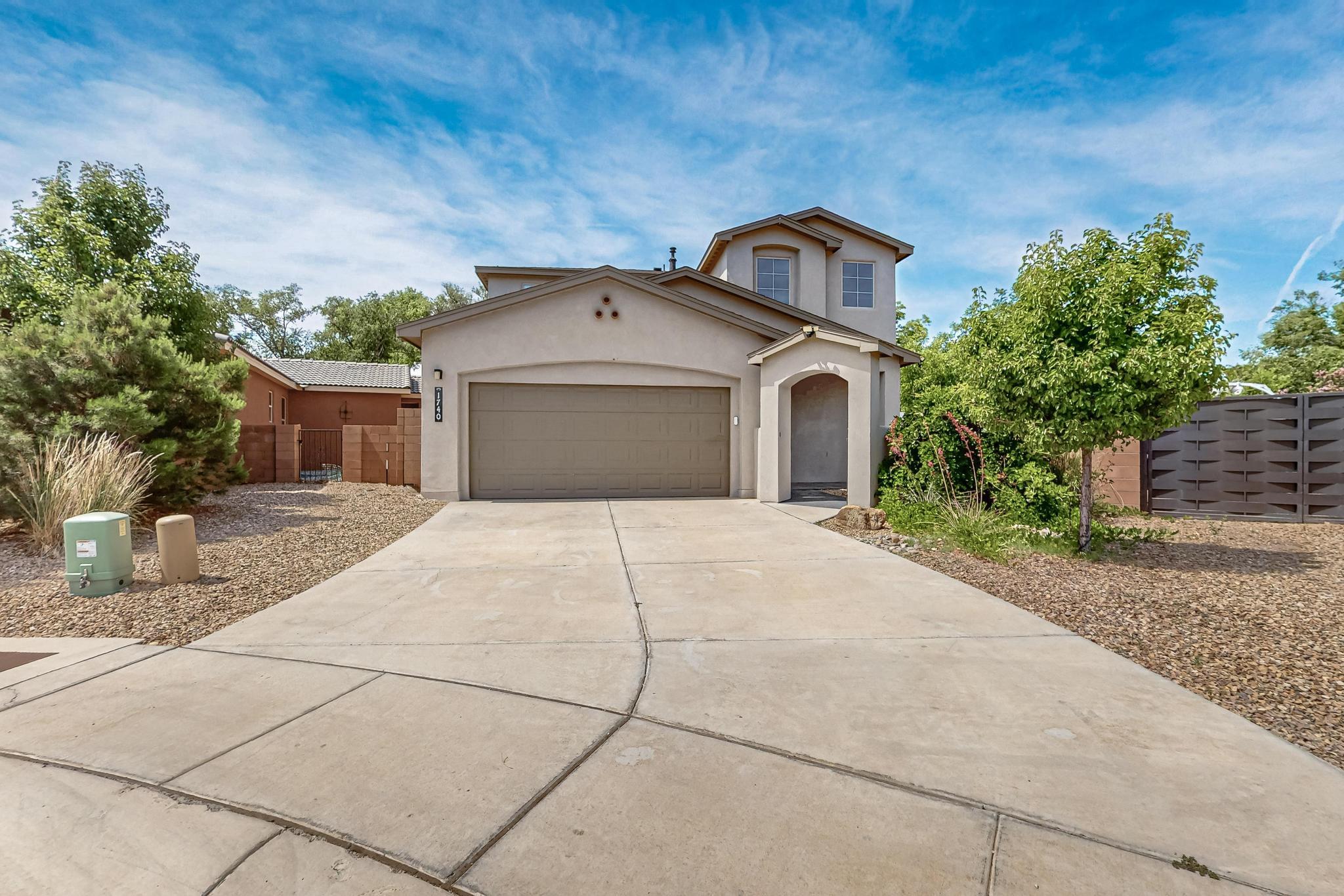 VA assumable @ 4%! Priced well below comps! Nestled in a serene, tranquil gated community near the Biopark, Tingley, Bosque trails, Old Town, this move-in ready 4 bedroom, 3 bathroom home offers an ideal blend of modern luxury and residential charm. Recently enhanced with over $20,000 in upgrades/additions, this house is primed to deliver both comfort and elegance to its new owners. Key features include: Custom iron gate for backyard access/RV/Boat storage, Custom landscaped backyard with turf, Auto Drip system, Refrigerated air, Tankless water heater, Granite countertops, Gated dog run, 10x12 Resin Shed, New Custom vinyl floor in loft and BR #4, New Vinyl stairs, Finished garage w/custom closet, Stainless Steel Appliances, Powder room and Master on Main