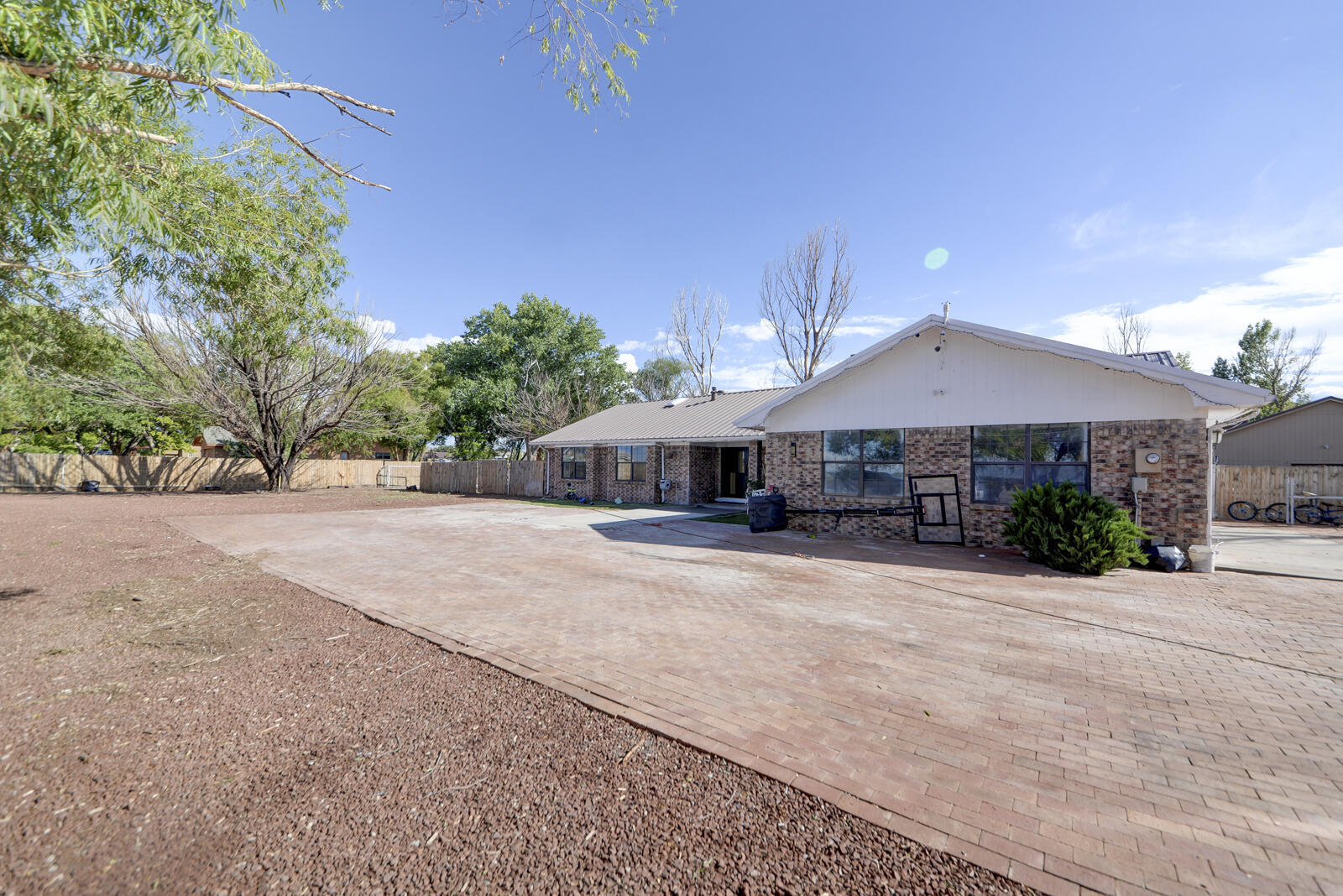 Luxury, country Living at its Best Offering Privacy and Tranquility. This Stunning ranch style Home is a must-see for anyone seeking a serene country feel just 10 minutes from downtown Albuquerque. Sits on 1.6 acre enjoy Nature Views and Ample Space for Family and Guests. Inside, you'll discover a beautifully designed floor plan that's both functional and inviting. This jewel includes a cozy office area/Bedroom, soaring vaulted ceilings, and a wet bar in the living room. Chefs Kitchen Features a Huge Island & Breakfast Nook, Granite counter tops, double oven. Master bedroom has granite counter tops full bath w/jetted tub, separate shower, walk-in closet and walk out to cover patio. Gated Entry for extra Security. Schedule your showing today!!!