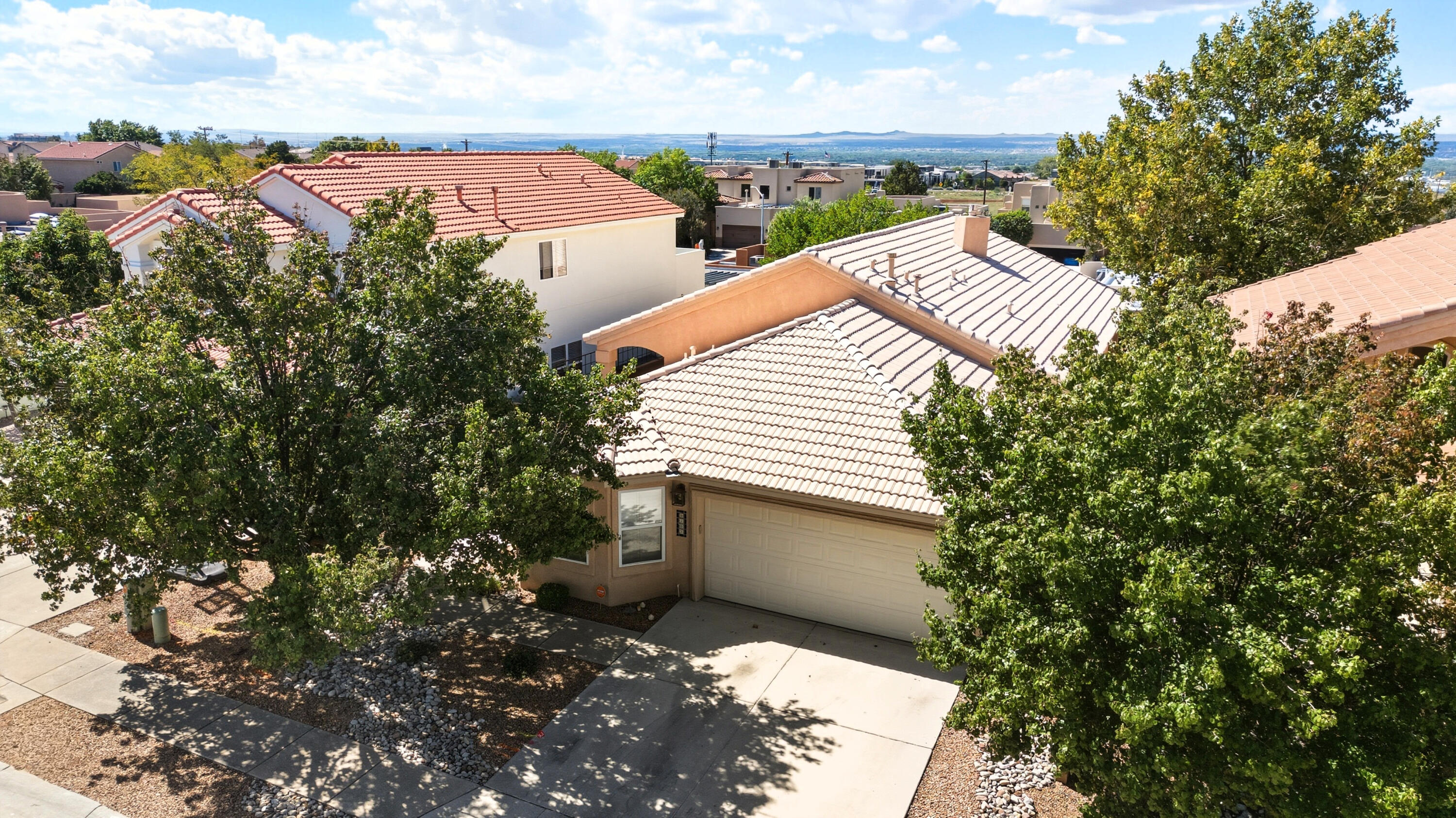 Welcome to 9105 Silver Sage in Desert Ridge Trails! This beautiful home has a bright, open great room with stylish floors, large windows, built-in shelving and easy patio access. Remote outdoor shades let you set the perfect mood at night. The kitchen has granite countertops and large, beautiful cabinets with a walk-in pantry. The spacious primary suite offers a generous closet and a stunning new walk-in shower, with added access to the laundry for convenience, all completed in 2024. Recent updates include a stainless refrigerator, dishwasher, and new carpet (2023). All appliances stay, including washer and dryer. This neighborhood is near Alameda and Paseo for easy commuting. Close to shopping, entertainment, and schools--this home blends comfort, style, and location!