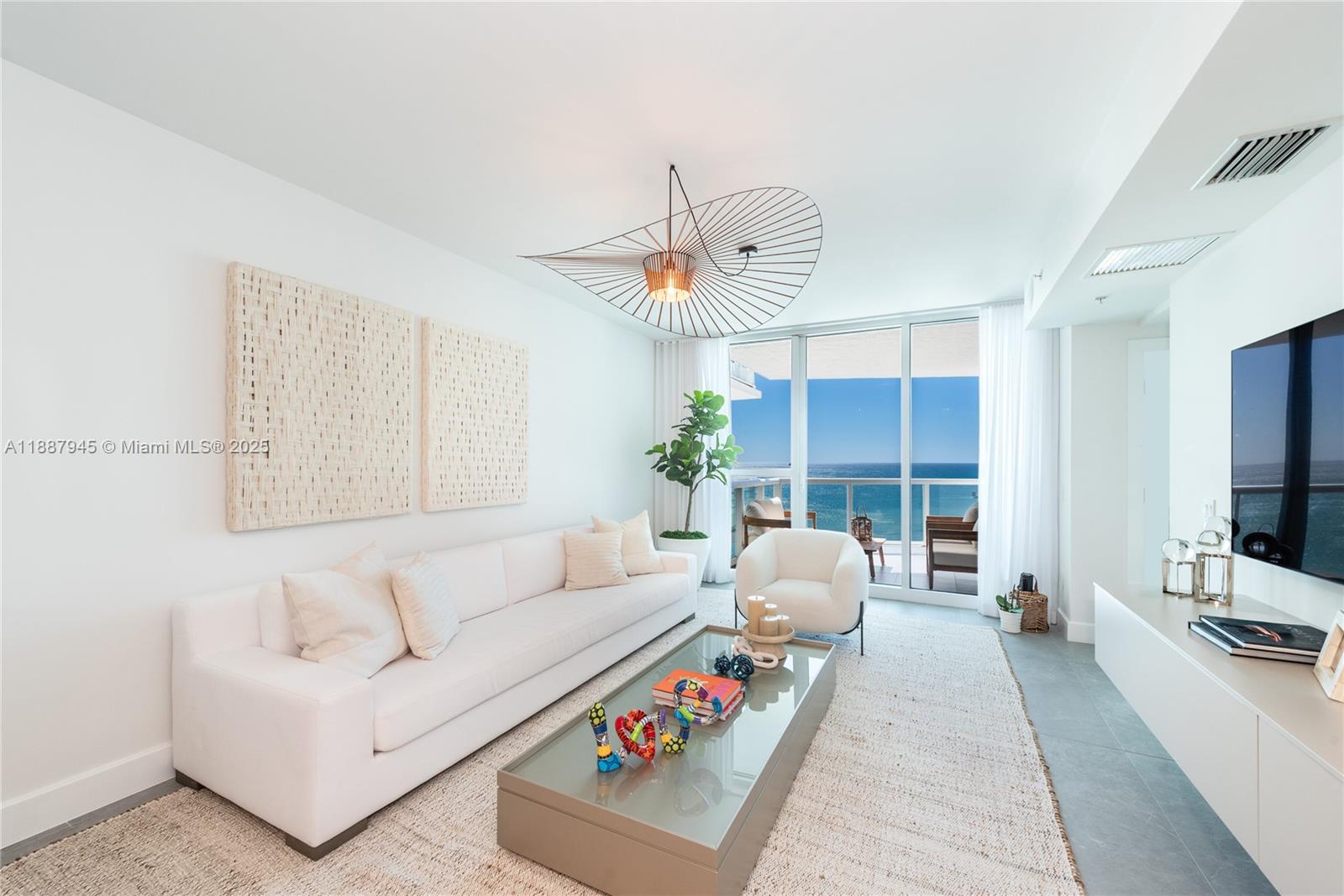 Mosaic Condo is an exclusive boutique building in Miami Beach with only 84 residences. This completely remodeled thru-unit features 3 spacious bedrooms, 3 bathrooms, and private balconies showcasing both direct ocean views and city skyline vistas. The open living area connects seamlessly with a gourmet kitchen, breakfast bar, and dining space, complemented by sleek tile floors and custom finishes throughout. The oceanfront primary suite offers balcony access and abundant natural light. Residents enjoy resort-style amenities including beach access with service, oceanfront pool, state-of-the-art gym, cinema, party room, concierge, valet, and 24-hour security—delivering the perfect mix of boutique privacy and Miami Beach luxury. Furniture can be included in the sale.