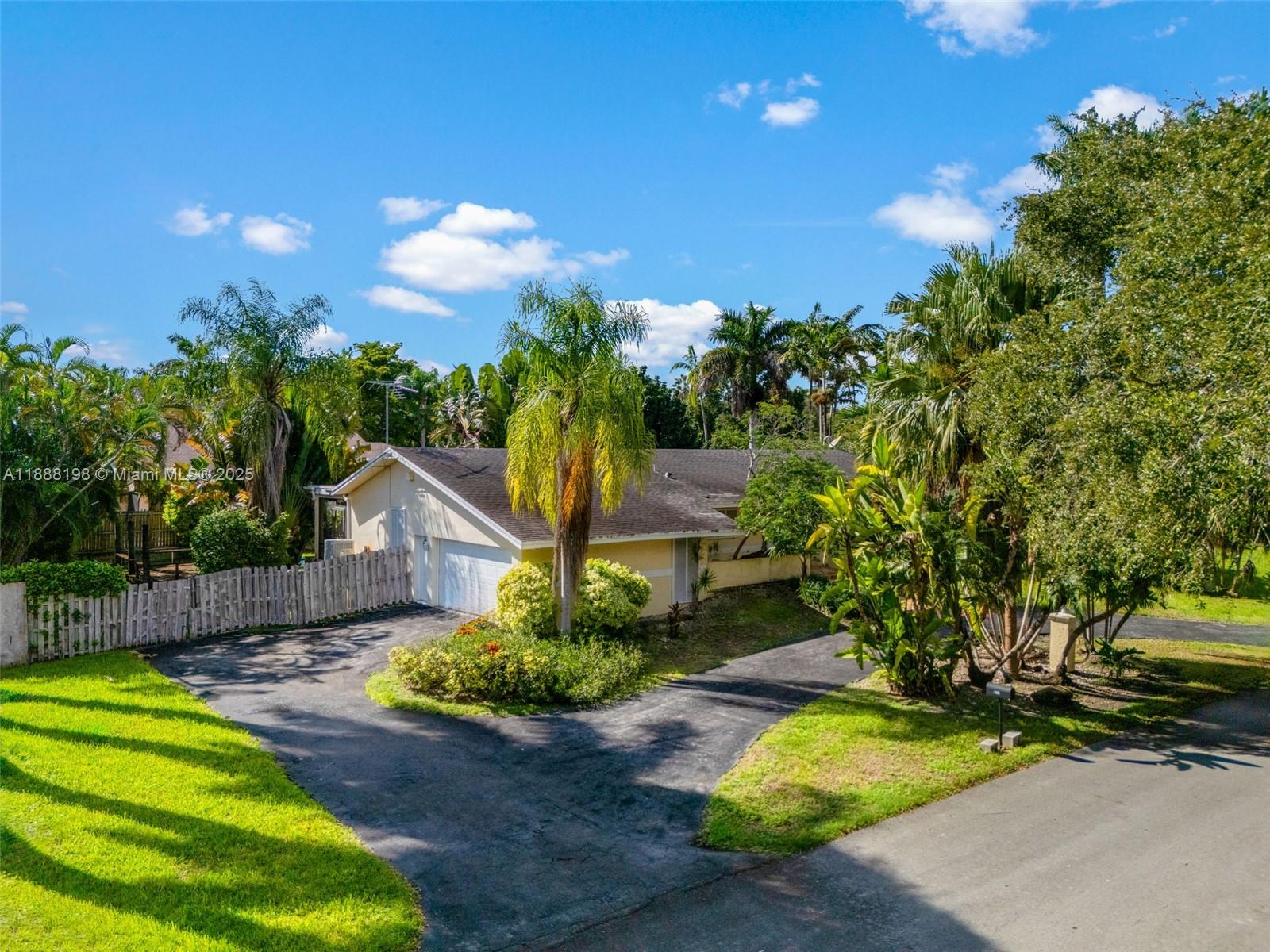 Spacious 4-bedroom, 2-bath home in the highly sought-after community of South Palmetto Bay! This residence offers over 2,700 sq. ft. of living area with a functional split-bedroom floor plan, a 2-car garage, and a bright, open layout. The home features a large family room, formal dining area, and an oversized kitchen with plenty of potential to make it your own. French doors open to a covered pool and patio area, ideal for year-round enjoyment and entertaining. Situated on a quiet street with mature landscaping, this property is ready for updates and personalization. Conveniently located near top-rated schools, shopping, dining, and parks.