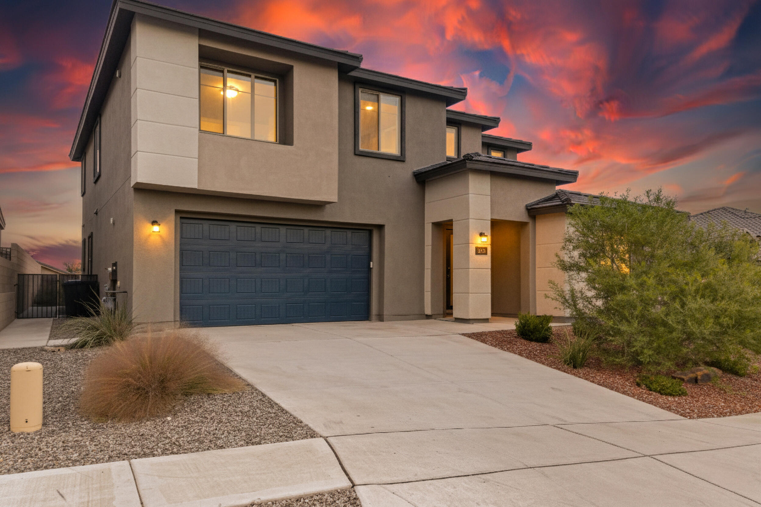 Better than new! This Pulte-built, energy-efficient multi-gen home features 5-6 bedrooms, including two luxurious primary suites--main upstairs with breathtaking views and in-law quarters plus an office on the main floor. Move in effortlessly with major upgrades complete! Entertain in the chef's kitchen with granite counters, stainless appliances, & upgraded sliding doors.  Relax in the loft that opens to a balcony with panoramic views of the Sandias & the whole city. Located across the street from the community park in the gated Inspiration community, with custom blinds, gas fireplace, tankless water heater, oversized finished garage, in-ground termite protection, & recently added back patio with stamped concrete & turf yard, fully landscaped with irrigation.  Make this one yours today!