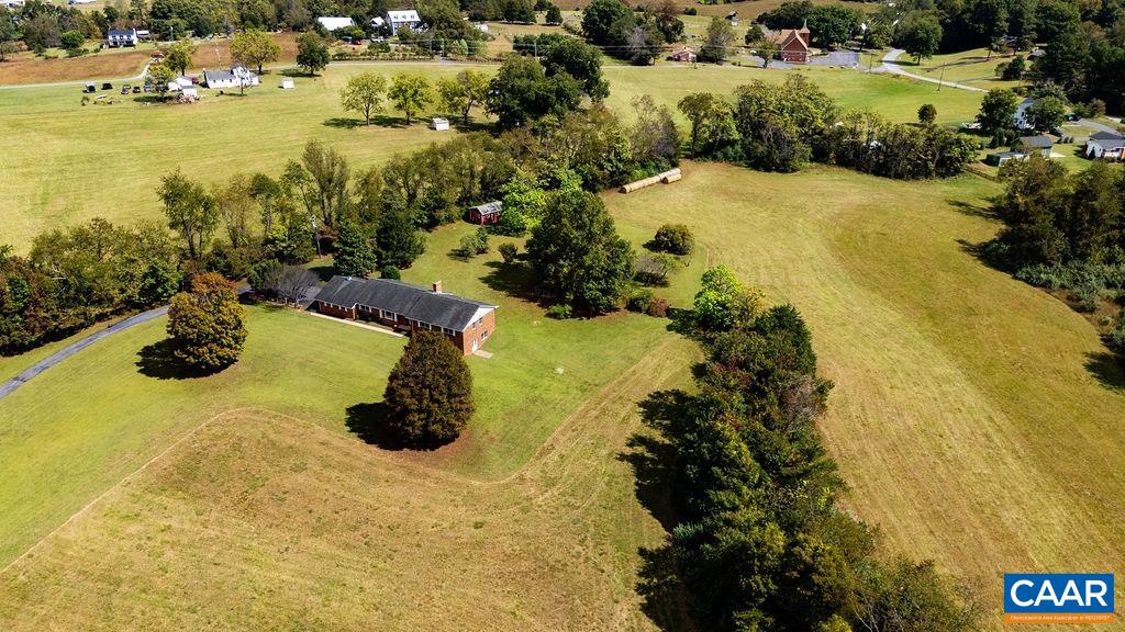 Stunning property, Stunning views and Stunning location create the Trifecta for this home.  Perched on a rolling hill with mesmerizing views of Elk Mountain and Humpback Rocks. A premier Afton address along the 151 Trail with easy access to Rt 250 and I 64, whether you are traveling east to Charlottesville or west to the Shenandoah Valley.  This gorgeous acreage has trees and pasture with split zoning encompassing Residential and Agriculture, all with Nelson County taxes. Versatility for every lifestyle with 3 bdrms and 2.5 baths. Traditional designed Ranch with spacious living, dining and family rooms each with hardwood floors. Covered rear porch leads to the drop zone entrance adjacent to the kitchen. Ample room and opportunity with a full unfinished basement. Low maintenance exterior with brick and vinyl allows more time to spend on the your land. Great detached shed to store tools, toys and equipment. Come enjoy a cool fall day and catch the Blue Ridge Mountain glory. Don't wait, make this your home before someone else makes it theirs.