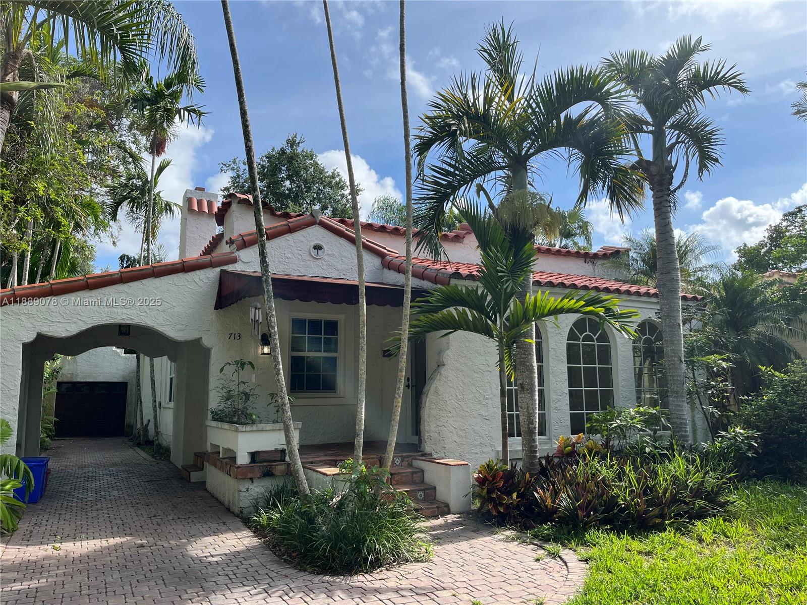 A Beautiful Old Spanish House with character and charm. Top Coral Gables location in the prestigious Platinum Triangle neighborhood. Close to the best private schools in the city and zoned to Sunset Elementary (one of the best Public Schools). The house features a spacious formal living and dining room, wood-burning fireplace, hardwood floors, breakfast area, impact windows, landscaped backyard, detached garage and covered carport.  Ideal for a family or professional looking for one of the best and quiet areas in Miami.