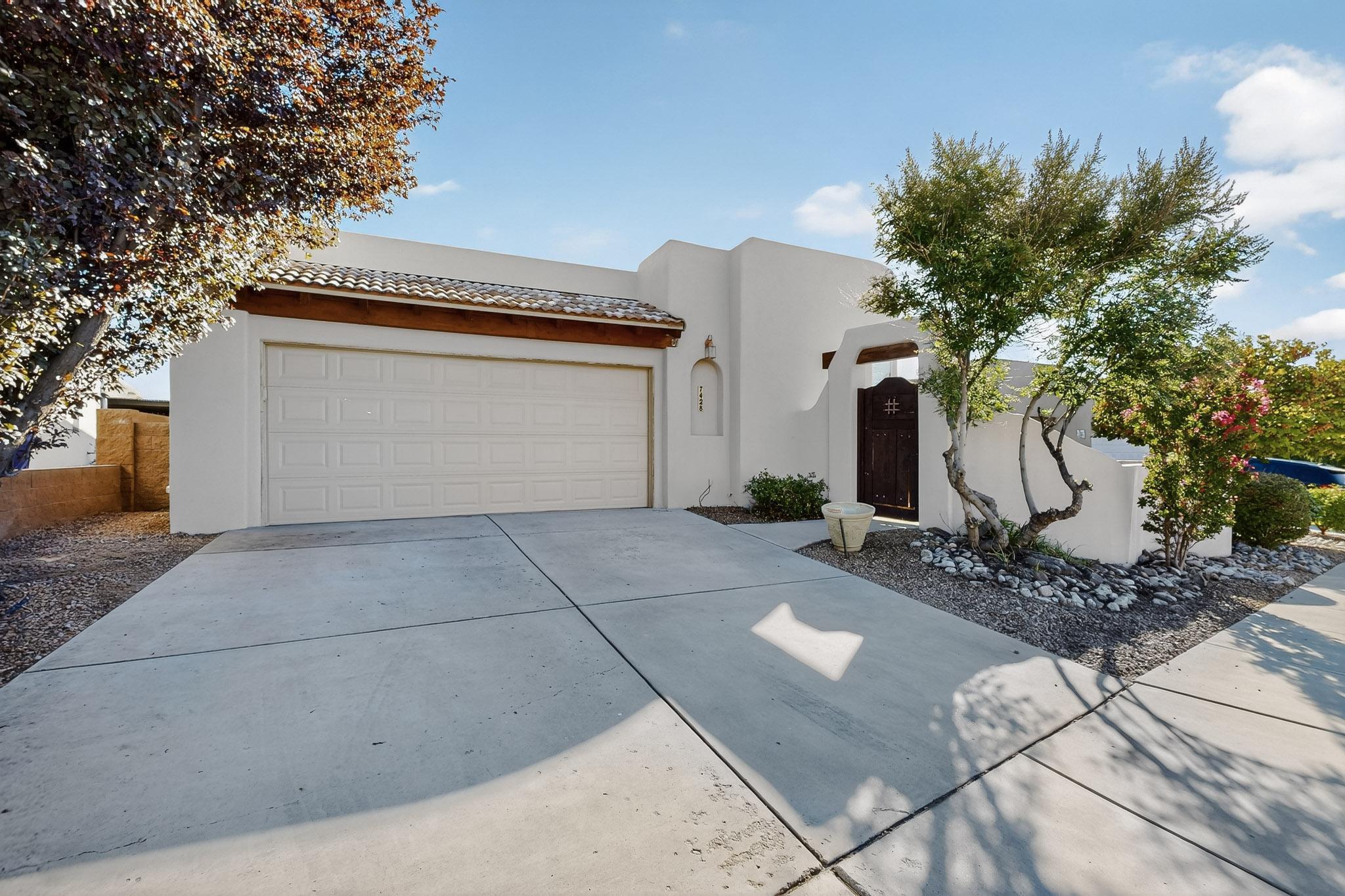 Nestled within the prestigious North Albuquerque Acres, this exceptional single-story home is located in a secure GATED community, offering privacy, comfort, and style. Featuring 4 bedrooms--including one that currently serves as a sophisticated office--this residence blends versatility with modern living. Step inside to discover a bright, inviting floor plan with thoughtful details throughout. The spacious primary suite is a true retreat, boasting an en-suite bathroom with dual vanities, a relaxing garden tub, a rejuvenating shower, and a large walk-in closet. The home also includes a solar energy system, providing eco-friendly efficiency and cost savings.