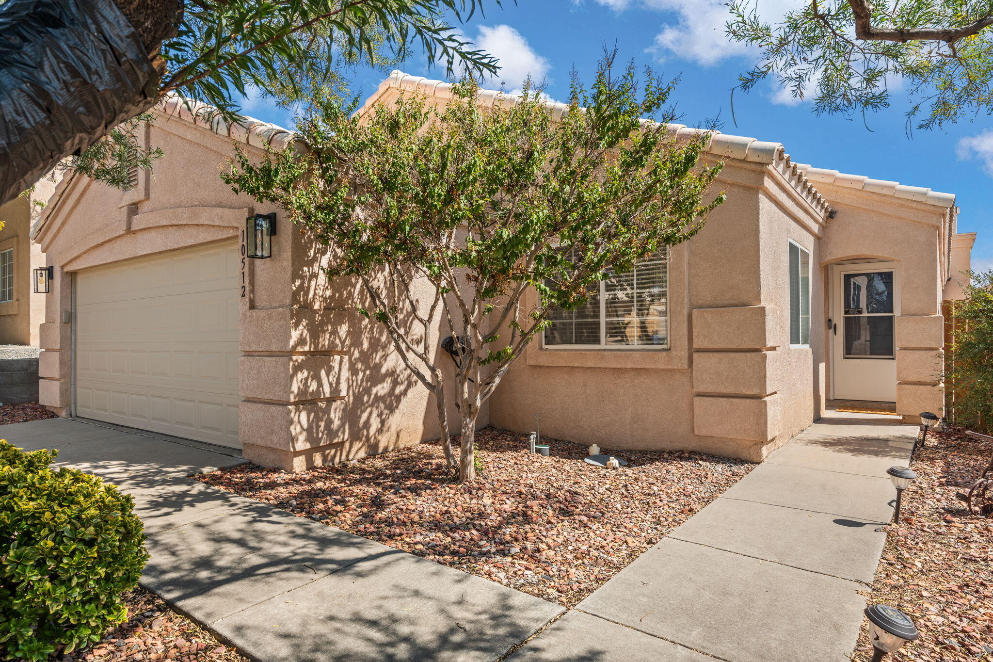 Tucked on a quiet cul-de-sac, this single-story home offers comfort, privacy, and thoughtful updates. Vaulted ceilings and plant ledges enhance the open feel, with two living areas and both formal and casual dining. The primary suite has a garden tub, separate shower, dual sinks, and private water closet. In 2024, the kitchen and bathrooms were beautifully updated with quartz countertops, complemented by new tile, carpet, and fresh paint throughout. Also, in 2024 a new evaporative cooler was installed. Enjoy the east-facing covered patio, low-maintenance yard, raised wall for privacy, and views. Nearby park offers tennis, a grassy field, and playground.
