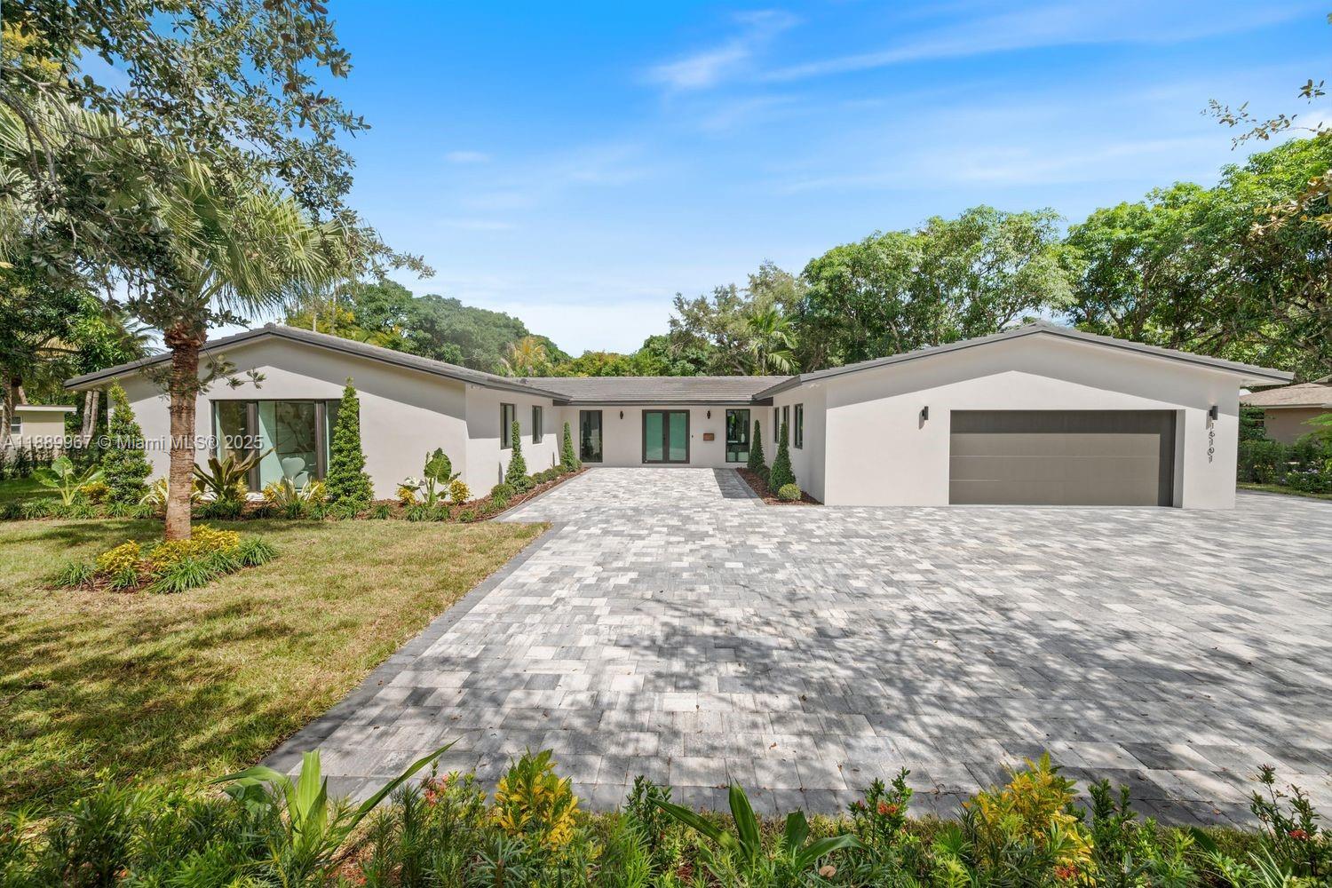 Fully renovated 5BR/4.5BA home in Palmetto Bay offering luxury and comfort. Chef’s kitchen boasts Thermador appliances, bespoke cabinetry, and an oversized island, complemented by custom millwork, European solid doors with Italian hardware, and abundant natural light. The split floor plan features a wet bar for entertaining and a private primary suite with spa-style bath and custom closet. Designer bathrooms include Toto toilets and high-end finishes. Built with quality upgrades PVC plumbing, impact windows/doors, two tankless water heaters, new air ducts, updated electrical, and whole-home generator. Enjoy a Brazilian-lumber terrace, resort-style pool with beach entry, cabana baths, and lush landscaping. Near A-rated schools, Coral Reef Park, and The Falls. Home is 2770 sq ft per sellers.