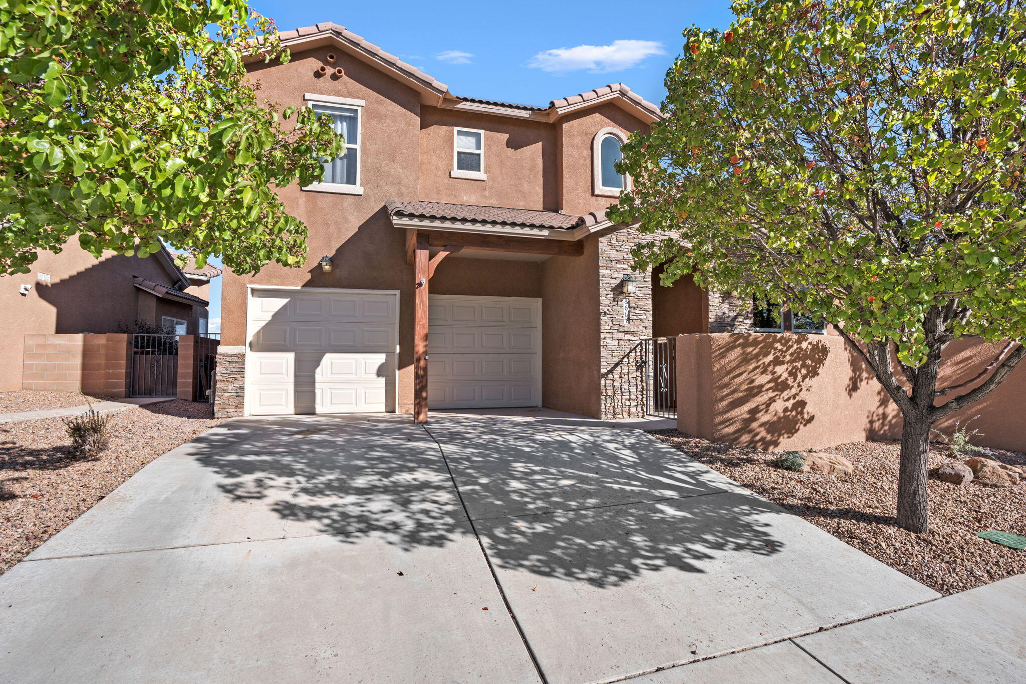 Breathtaking Sandia Mountain views await! This home on the best lot in the neighborhood :-) offers indoor comfort and resort-style living. The east-facing backyard provides afternoon shade, a sparkling pool, raised patio, views, and multiple patios front and side. Lush landscaping and mature trees create a private retreat. The main floor Owner's Suite features a sitting room, two-way fireplace, spa bath with dual vanities, tub, shower, and large walk-in closet. Soaring ceilings and an open floor plan connect to a chef's kitchen with granite, stainless appls, island, pantry, and butler's pantry. Upstairs is a spacious loft plus two bedrooms. Neighborhood park, nearby golf, and quick access to I-25, the airport, ABQ, and Santa Fe, this home is a 10!