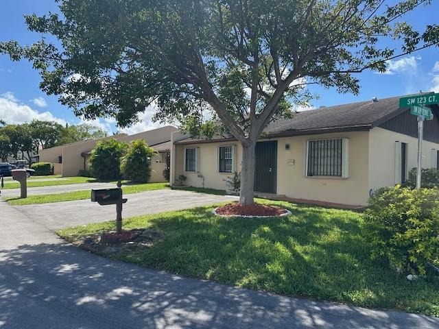 Great opportunity to own this beautiful corner unit in sought after Devon Aire #4 Community. Boasting neutral colors throughout with 3 bedrooms & 2 bathrooms & an extended, fully screened, private porch, great for entertaining & extra space with a storage/tool closet, laundry room with full size washer & dryer & a convenient utility sink, extra tool/storage shed/closet. This porch offers privacy & is well lit and ventilated with 3 ceiling fans with light. This home has ample closet space & offers attic storage with pull-down stairs for easy access. Great corner unit location offers extra green/garden space, & the location is walking distance from shopping, dining, banking, etc. & just half mile from the Florida Turnpike for easy commuting. Easy to show. Come see it yourself!