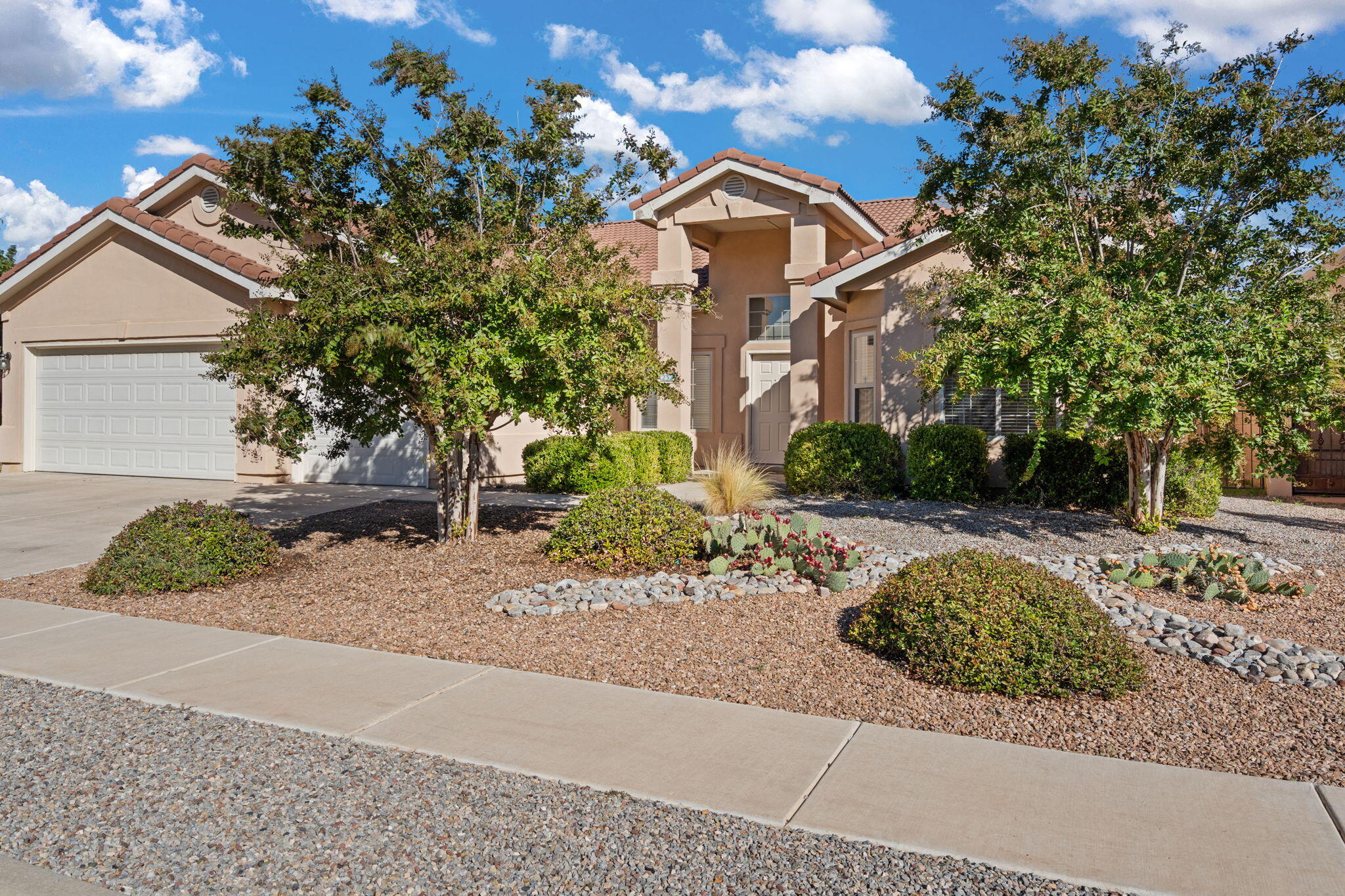Beautiful single-story home next to the Petroglyphs at just under 3,000 sq. ft. with an oversized 3-car garage. This open and bright floor plan features soaring ceilings, split bedrooms, and a large great room perfect for gatherings. The gourmet kitchen includes granite countertops, stainless steel appliances, a gas stove, breakfast bar, and nook, all flowing easily into the dining and living spaces. The primary suite offers generous walk-in closet. Enjoy refrigerated air, ample storage, and a beautifully landscaped backyard ideal for outdoor entertaining. Move-in ready.