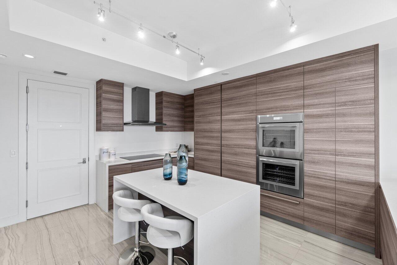 Experience luxury living at its finest in this breathtaking 12th-floor penthouse located in the heart of East Boca. Boasting panoramic ocean and city views, this contemporary furnished 3 bedroom, 3.5-bath residence offers unmatched elegance and style. The master suite is conveniently located on the main floor, providing ultimate privacy & comfort. Floor-to-ceiling windows flood the space with natural light. The chef's kitchen features quartz countertops, Italian cabinetry, Subzero refrigerator, & a spacious center island perfect for entertaining. Steps away from downtown Boca & Mizner Park, this penthouse combines upscale living with unparalleled convenience. Don't miss the opportunity to make this extraordinary residence your own!