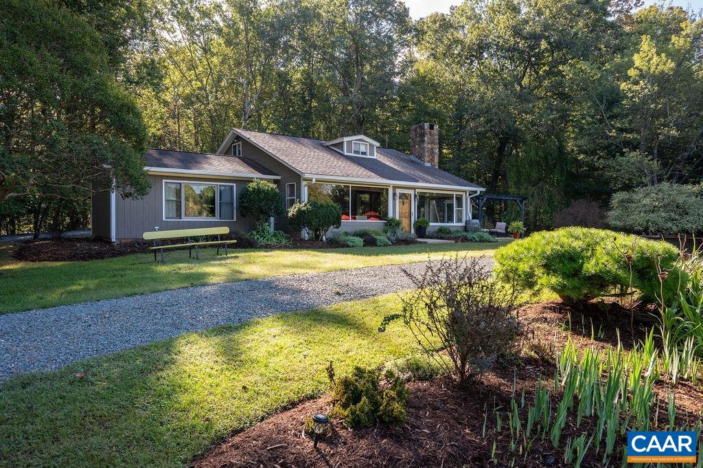 Welcome to this exceptional 3-bed, 2-bath country cottage offering ~2100sf of comfortable single-level living + 2nd floor bonus room. Thoughtfully updated throughout, this home features a light-filled layout, updated kitchen and baths, spacious primary suite, home office, and 2 additional bedrooms. Step outside to your private oasis with a covered patio boasting mountain views and sparkling in-ground pool—perfect for summer entertaining or peaceful evenings. The generous 4.66ac lot provides room for gardening, play, or quiet relaxation. 2 car garage with mudroom entrance + 2 sheds for additional workspace and storage. Enjoy reliable high-speed internet for remote work or streaming, and no HOA fees for added freedom and value. Ideally located 15 minutes to Downtown Charlottesville. With easy access to local dining, healthcare, and entertainment, this move-in-ready home combines modern updates, convenient location, outdoor living, and rural Virginia charm.