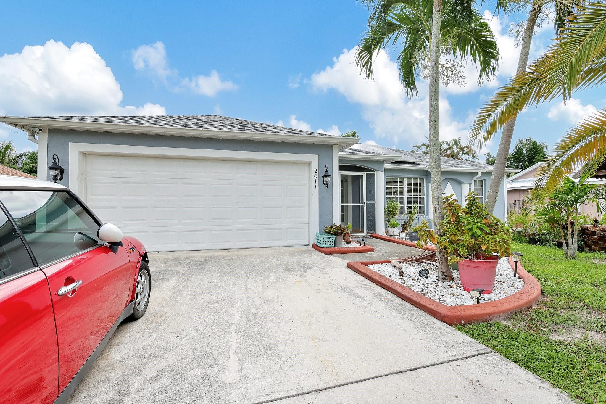 This must see home will go fast!! It's a split bedroom floor plan. Master bedroom has large walk-in Master closet & soaking tub for relaxation. Kitchen has beautiful granite counter tops, new stainless steel stove & plenty of cabinetry. Tile flooring throughout. Water heater is new. Large enclosed back lanai. Beautiful White Vinyl Fence yard. Back yard is private & has a variety of tropical fruit trees. Roof recently changed. House has Solar panels which will be paid off at closing. Don't forget the convenient location!! Just a short drive to Crosstown Pkwy, I-95, Turnpike, St. Lucie West and Tradition too! Great schools and a public park within walking distance. This home is worth seeing in person! NO HOA
