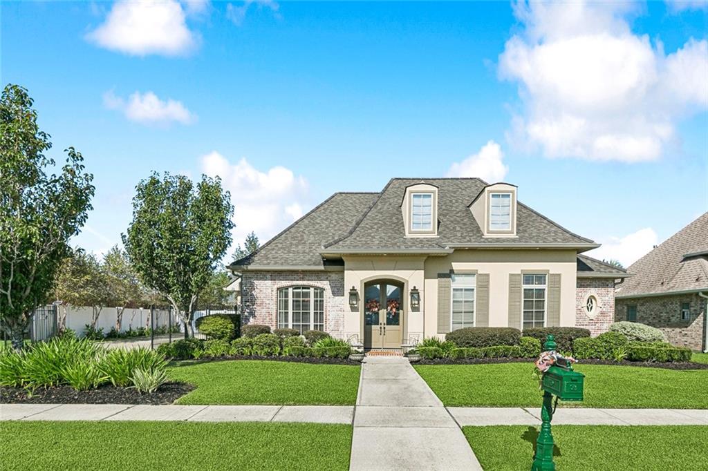 ?? Former Parade of Homes in Ashton Plantation!
This stunning 4-bedroom, 2.5-bath single story home offers nearly 2,500 sqft of elegant living space and thoughtful design throughout. From the moment you arrive, you’ll be impressed by the beautifully landscaped front and back yards and the oversized driveway with an electric wrought iron gate leading to a double car garage with a convenient dedicated workshop. There’s also plenty of space for boat, RV, or ATV storage for those who love outdoor adventure. Step outside to your backyard oasis, featuring a covered brick patio, gas hookup for outdoor entertaining, and lush landscaping for relaxing or hosting gatherings.
Inside, the home showcases an open and inviting floor plan, highlighted by floor-to-ceiling windows along the rear of the home that flood the living areas with natural light and serene backyard views. The gourmet kitchen is a true showstopper—featuring a 36” Wolf range, custom cabinetry, and plenty of counter space for entertaining or everyday living.
The spacious primary suite provides a private retreat, complete with dual walk-in closets, a separate shower, and a jacuzzi tub for ultimate relaxation. The home’s dual-zoned HVAC system ensures comfort and efficiency year-round, while the additional bedrooms offer flexibility for family or guests.
Conveniently located just 30 minutes to the CBD and 15 minutes to New Orleans International Airport, this home offers both comfort and accessibility. Enjoy all the amenities Ashton Plantation has to offer, including a community center with a pool, walking trails, and more. Plus, just down the street is Bridge Park, complete with tennis courts, softball fields, and a nearby bike trail along the levee.
? Schedule your private showing today and see why this home truly stands out from the rest!