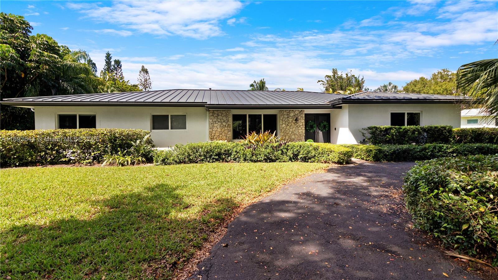 Lush 4BR/2BA home in North Palmetto Bay, just minutes from Pinecrest and 5 minute walk to Coral Reef Park. This Home sits on an 17,400+ sq ft lot & offers 2,800+ sq ft of living space with a modern kitchen, upgraded baths, and an open floor plan. Enjoy a screened-in pool, covered terrace, and enjoy the convenience of a TWO-car garage PLUS storage room. Features a brand-new aluminum metal roof and two newer A/C units. Prime location near top schools, parks, and shops — a true Palmetto Bay gem!