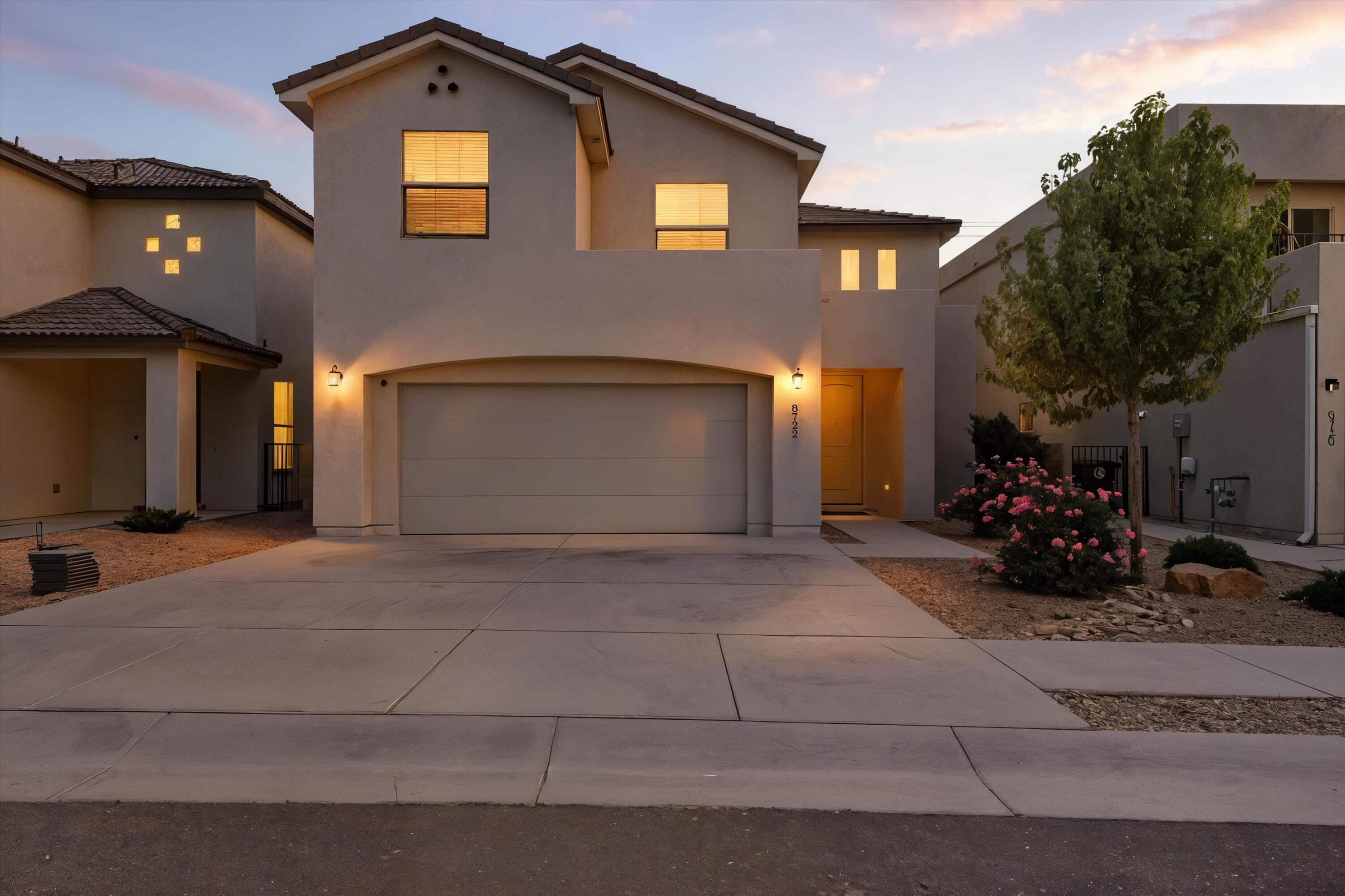 SLEEK STYLE MEETS FUNCTIONAL DESIGN IN THIS MODERN 2-STORY NE HEIGHTS HOME! Featuring 4 bedrooms and 3.5 bathrooms, this bright open layout showcases high ceilings, wood-look tile, and a stylish kitchen with island, bar seating, and built-in appliances. The downstairs primary suite offers a spa-like bath with double sinks, garden tub, separate shower, and walk-in closet. Upstairs, enjoy both a versatile loft and a spacious flex room--ideal for a second living area, TV room, or guest bedroom--with access to a balcony capturing mountain views. Outside, relax on the covered patio, practice on the putting green, and unwind in your beautifully landscaped yard. Schedule your tour today!