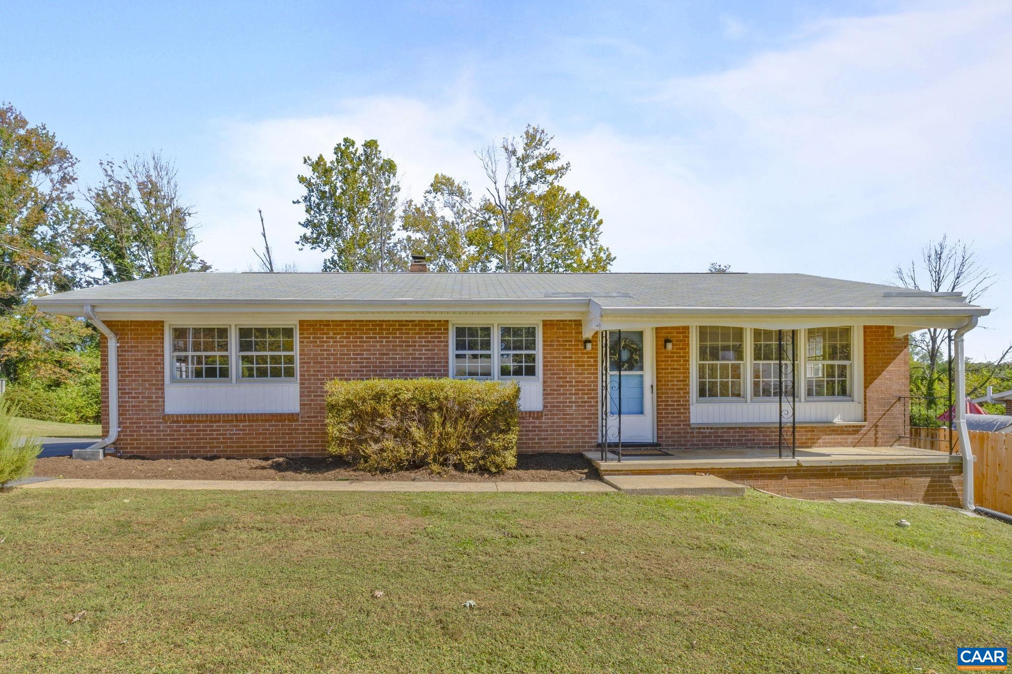 Enjoy one-leveling living in this pristine four-bedroom Berkeley brick rancher, complete with a level, sunny backyard in an established neighborhood, just moments from everything. Enter the front door into the home's living room complete with built-ins, and open to the light-filled dining area and kitchen. A sweet side porch ideal for morning coffee is accessed from kitchen, leading down to a backyard patio perfect for entertaining. Back inside, a hallway leads to a renovated full bathroom with large walk-in shower and three hardwood-floored bedrooms, including the primary with its own remodeled half bath. The staircase off of the kitchen takes you to the finished portion of basement, featuring a large family room and a generous fourth bedroom, all with ceramic tile flooring. An expansive unfinished space boasts plentiful storage space and laundry utilities with an exterior exit to the backyard. Located within walking distance of a major shopping center (29th Place, formerly Shoppers World) with restaurants and coffee, as well as ACAC's large fitness center Adventure Central nearby, and mere seconds to US-29 for commuting by car to anywhere in Charlottesville!