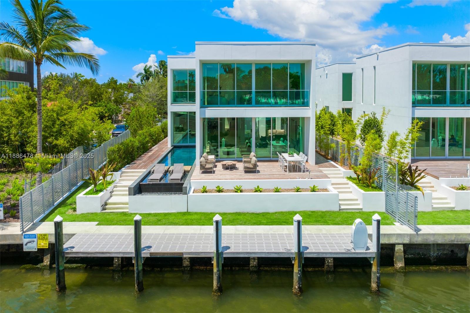Indulge in waterfront luxury at The Ritz-Carlton Residences. One of only eight exclusive two-story villas by Piero Lissoni, this rare home embodies tropical modern elegance with a neutral palette, soaring ceilings, and walls of glass that frame breathtaking water views. Boasting 55 ft of prime frontage on Surprise Lake with direct access to Biscayne Bay, the Intracoastal, and the Atlantic Ocean, this villa seamlessly blends privacy with resort-style living. Experience a lifestyle of distinction with the five-star amenities, personalized services, and world-class sophistication that only The Ritz-Carlton can provide. Exclusivity meets the pinnacle of South Florida luxury: located in the heart of Miami with close proximity to Sunset Harbour, world-renowned restaurants, shops & beach clubs.