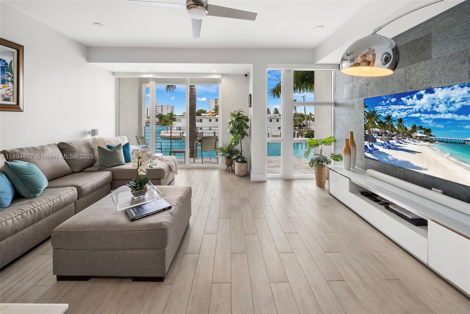 Stunning 4-story waterfront townhome with private dock in Iris on the Bay, Miami Beach. Enjoy modern luxury and Biscayne Bay access from private 40-ft deep-water dock at your front door. Built in 2019, this elegant home offers an open layout w/ abundant natural light, multiple balconies, and panoramic water views. The European-style kitchen features premium appliances, gas range, and sleek cabinetry. Four en-suite bedrooms each w/ spa-like baths, walk-in closets, and private balconies. A private elevator leads to a rooftop terrace w/ outdoor kitchen and spectacular views. Impact windows and doors, full-size laundry, 2-car garage. Residents enjoy a waterfront pool and gated security, minutes from the beach, Bal Harbor, and fine dining. Offered fully furnished, boat slip $360K value included