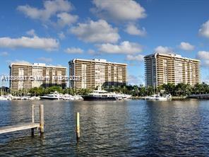 Located in Grove Isle Building One, this spacious (1882 SF) 2 bedroom 2 bath unit offers unobstructed views of Biscayne Bay, Dinner Key Marina, and Coconut Grove. The property features a large balcony, accessible from the living room and primary bedroom, split bedroom plan, gourmet open kitchen with 3 ovens, granite counter tops and stainless appliances, built-ins for abundant storage, custom closets, marble floors in the living area, impact windows and doors. A beautiful place to live in and enjoy Grove Isle, a 20-acre private island with resort amenities: 2 pools, a gym, tiki huts with barbeques, a playground and playrooms for the children, and more! Soon to have pickleball and tennis courts!