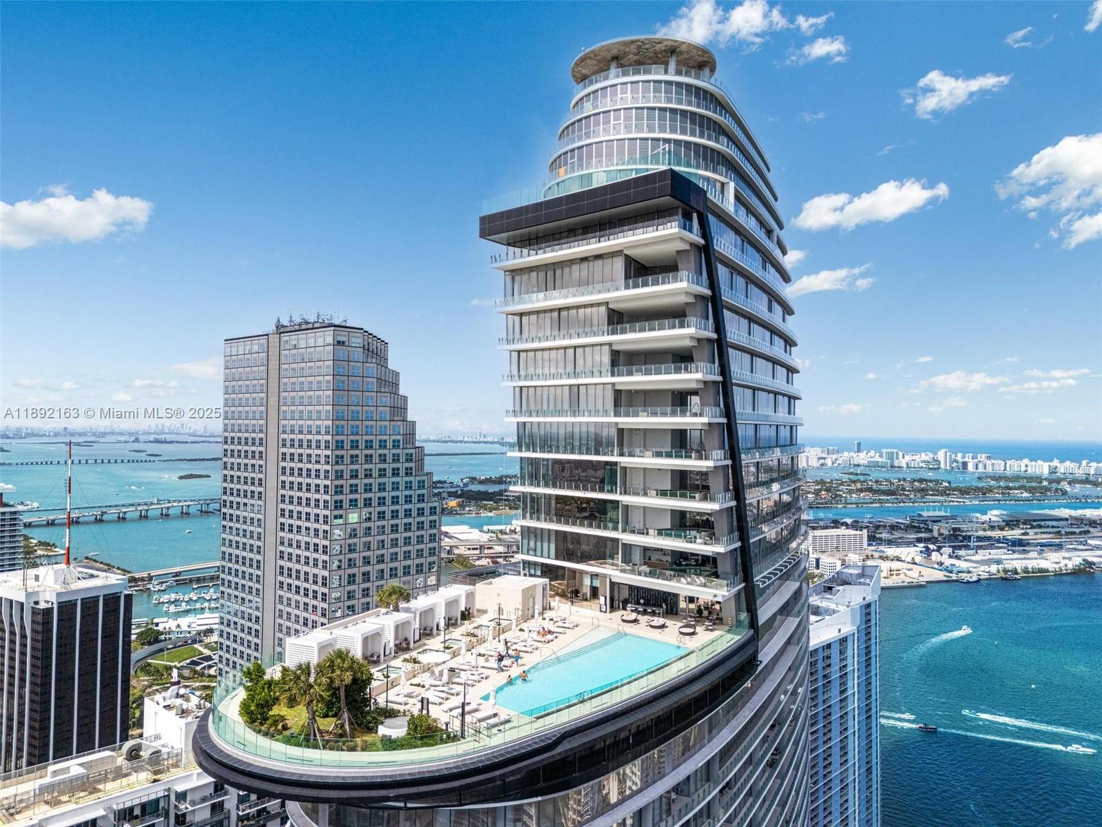 Sky-High Elegance in the Aston Martin Residences- 45th Floor Line 07.
Experience luxury living in this 2-bed, 3-bath unit featuring approximately 1,871 sq ft of refined interior space (plus terrace). Floor-to-ceiling windows offer sweeping vistas of Biscayne Bay, the Miami skyline, and the River. Gourmet kitchen with premium finishes, spa-inspired baths, and a private elevator/ foyer/entry. Building amenities include infinity pools, fitness & wellness spa, theater, full-service marina, and concierge services. Secure parking with valet. Pets considered per association rules.