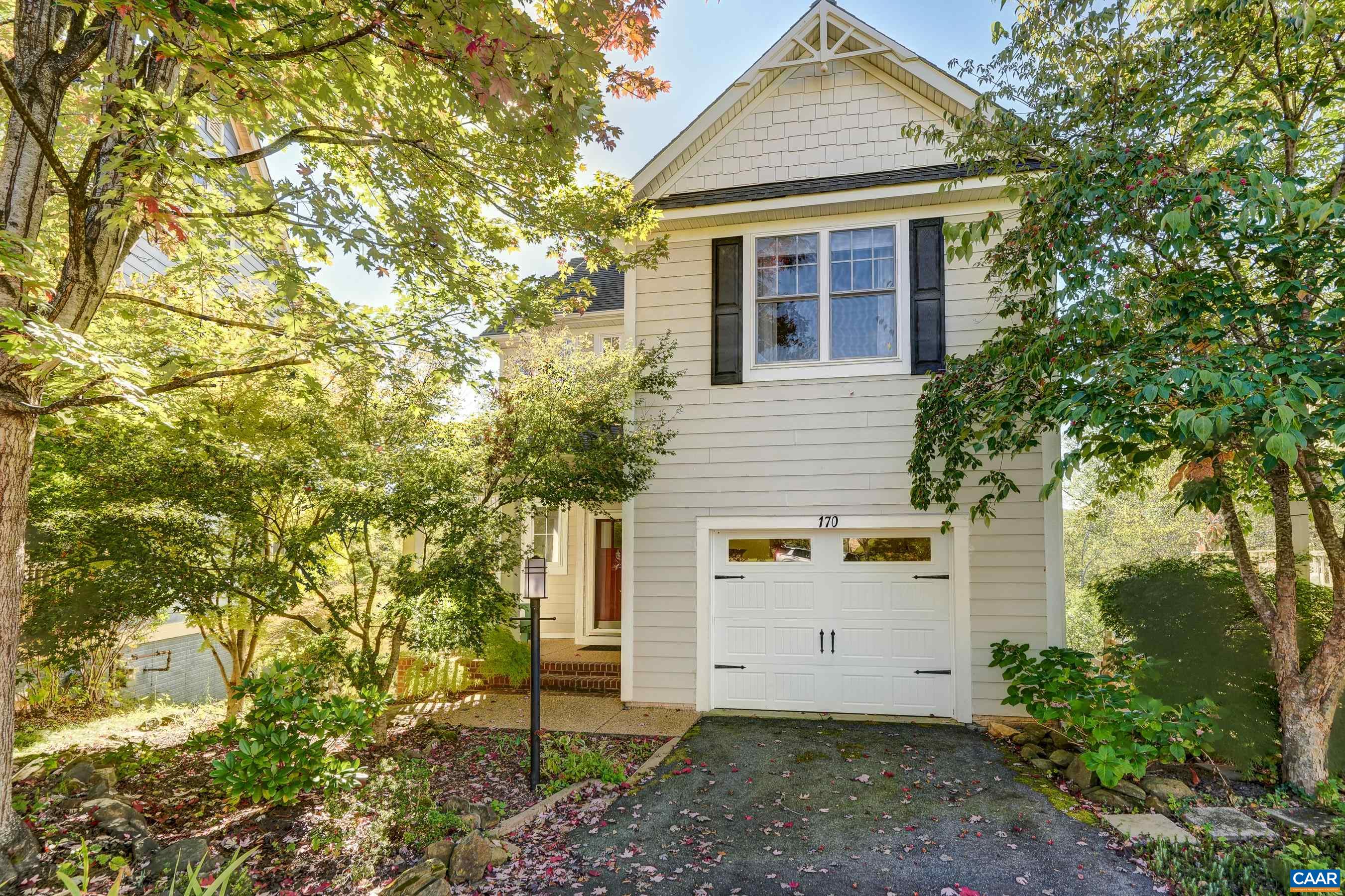 This charming home backs up to the Rivanna Trails and Moores Creek, and feels like a tranquil oasis, yet is walkable to Downtown Charlottesville, and is minutes from I64.  You'll love the seasonal mountain views that can be seen from either of two composite decks. With no HOA, this home could be a great Air BnB unit! The open floor plan of the main level includes three light-filled living spaces with a great room and dining area that flow into the practical and polished kitchen. Hardwood floors sparkle in the light from the wall of windows overlooking the natural spaces behind the home.  Upstairs, the primary suite includes an ensuite bathroom with heated tile flooring, soaking tub, and separate shower.  Two additional bedrooms share a full hall bathroom, and the laundry room is upstairs for convenience. A loft space upstairs makes a great space for a home office or reading nook.  Enjoy even more living space with a large walk-out lower level featuring a rec room leading to a second deck with pergola and full bathroom. With solar panels to keep the energy costs low, a one car garage, and so much more, this home is a must see!