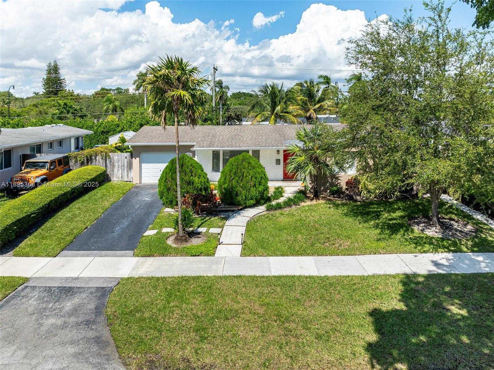 Charming 3/2 home with a versatile layout. Includes a private suite option and extra finished rooms offering endless possibilities — office, gym, or guest area — all connected under one roof.  Great location in Whispering Pines, artist owner added her own touches to this house.  Open area concept, with a gorgeous center island, great for entertaining, porcelain floors, impact windows.  Large covered patio overlooking the lush garden and pool.