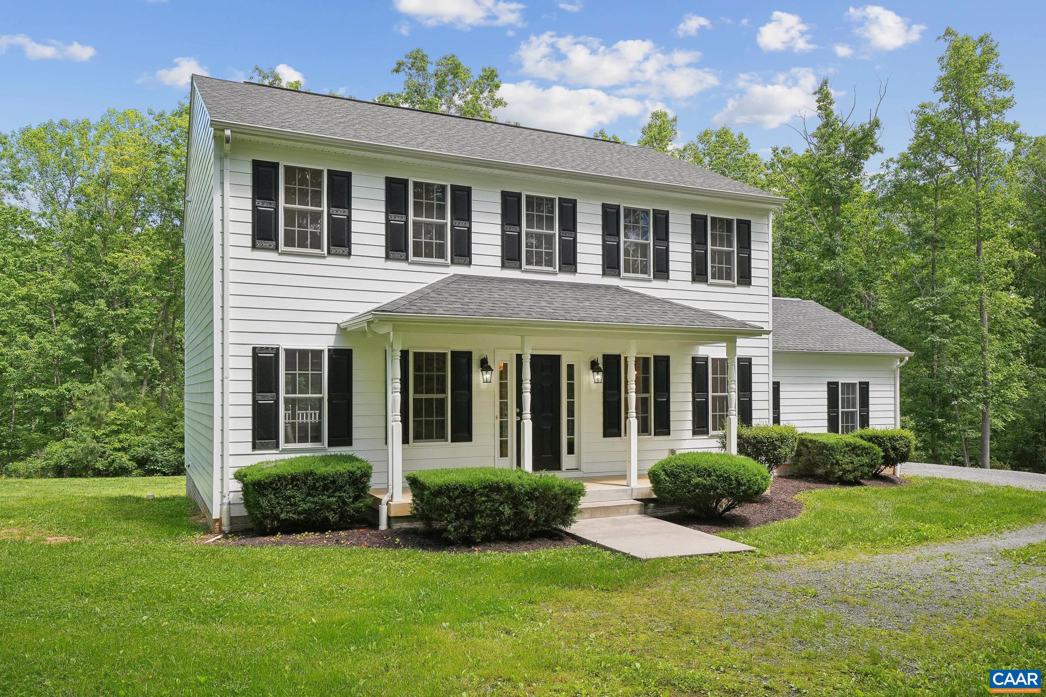 Beautiful home sitting on over 22 acres just south of Charlottesville, Virginia. This 3,000 square foot, colonial style home was built in 2010 and has 5 bedrooms, 3.5 bathrooms, an attached 2 car garage, and a fully finished walkout basement. There are beautiful hardwood floors, conveying furniture, high speed fiber internet, whole house Generac generator, and an elevated rear deck (Trex) overlooking the large, secluded backyard. The 22.5 acres consist of wonderful hardwoods with many oak trees, including white oaks and chestnut oaks. This is a turn key opportunity for those looking to be close to town, but live on a private lot with acreage to enjoy. Located approximately 25 minutes south of Charlottesville, 5 minutes from Scottsville and the James River, and minutes from the Mount Ida Reserve Winery and Taphouse and other notable wineries and attractions.