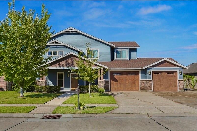 A standout home in every sense of the word! Just step inside and it will instantly wow —crafted with character, designed for comfort, and packed with thoughtful features hard to find anywhere else in the neighborhood.
Inside, four spacious bedrooms and 2.5 baths flow effortlessly with warm, craftsman-style details and a layout made for modern living. The primary suite offers a peaceful retreat, complete with private patio access and a master bath closet that connects directly to the laundry room—talk about convenience! Upstairs, you’ll find a large bonus room already wired as a home theater—perfect for movie nights or game-day gatherings. A built-in laundry chute from the second floor drops directly into the laundry room below, making life just a little easier (and a lot more fun).
Outside, the covered back porch features a serene pond and lush greenery—an inviting space to unwind, with no rear neighbors in sight. The front and back porch speakers set the mood for relaxing evenings or weekend entertaining.
Some updates include a 2022 roof, dual AC units replaced within the past two years, a gas hookup ready for a home generator with converter, and a power-vent gas tankless water heater. The fireplace can be enjoyed with wood or gas, depending on your mood. And with a two-car garage plus an additional garage and extra driveway parking, there’s room for every vehicle, boat, or hobby project.
Every detail has been designed with care, comfort, and craftsmanship. This is more than a home—it’s a statement of thoughtful living in a neighborhood where nothing else compares!