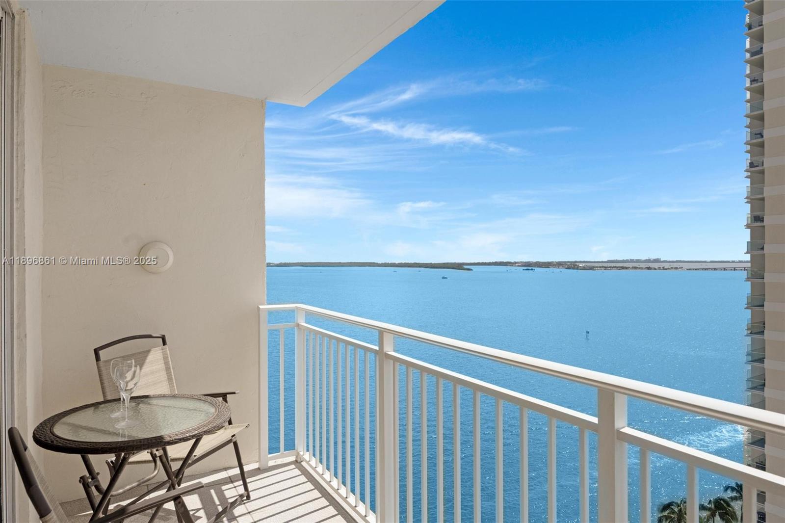 Live the island lifestyle on prestigious, private Brickell Key. This Isola residence offers stunning views of Biscayne Bay, the ocean, and the Brickell skyline. Features include an open-concept kitchen with granite countertops, newer stainless steel appliances and A/C system, luxury vinyl floors, and in-unit washer/dryer. Enjoy newly updated resort-style amenities: heated pool and spa, BBQ areas, waterfront party space, mini-golf, and tennis/pickleball courts. Additional amenities include 24-hour concierge, valet, conference room and business center, and 24-hour convenience store. Stroll or jog along the waterfront path, cafés, restaurants, and markets, just minutes from Brickell City Centre, airport, Miami Beach, Coral Gables, and Key Biscayne. Special assessment fully paid!