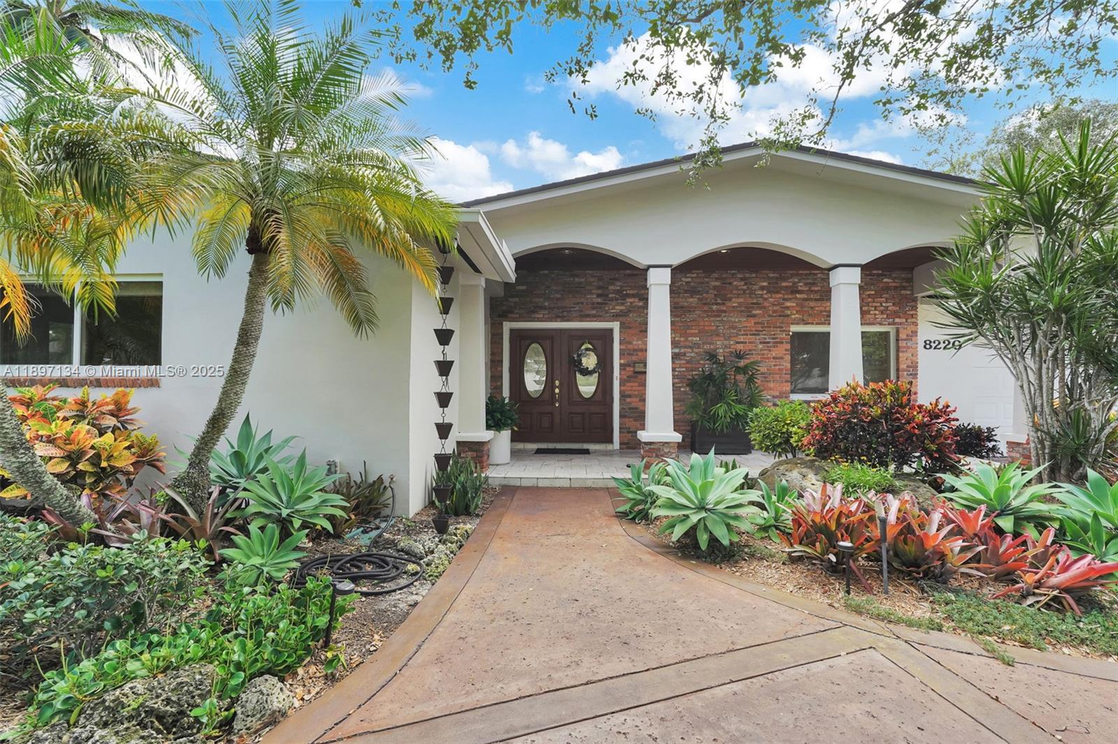 Located in the heart of Palmetto Bay, this meticulously maintained 4BR/3BA home is where memories are waiting to be made. The remodeled eat-in kitchen and wet bar are perfect for entertaining. Enjoy a private tropical oasis featuring a pool, built-in outdoor kitchen, pergola dining area, fire pit, and space to garden or play horseshoes. Generously sized bedrooms offer comfort, while the primary suite boasts a large walk-in closet, and a renovated spa-like bath offers natural light and high ceilings. Ample parking includes a circular driveway, 2-car garage, and covered car/boat port. Walking distance to A-rated schools and parks—don’t miss this special home! Available furnished or unfurnished and indicate that it’s also available for 6 month rental.