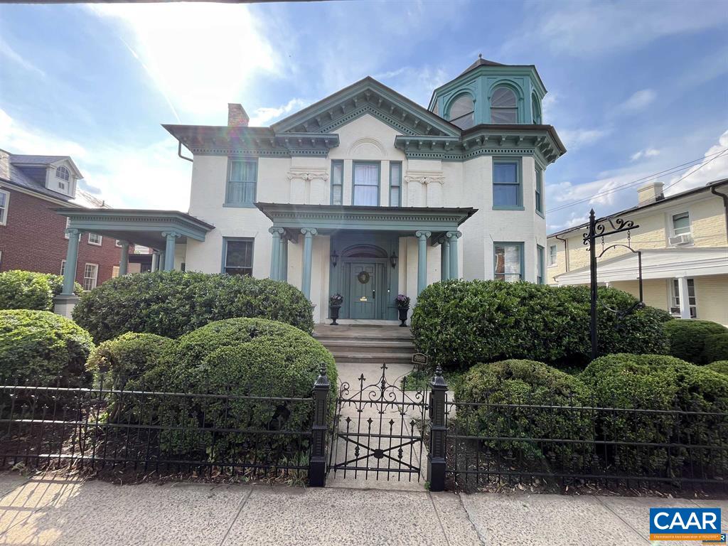 Welcome home to 409 Park Street. Located just two blocks from the Downtown Mall, stroll to Fridays After Five concerts at the TingPavilion, shop at local stores, enjoy the culinary delights of Cville's exceptional restaurants, or peruse the weekly farmer's market to create your own in the large open chef's kitchen of this thoughtfully restored gem. Keeping all the charm of this Queen Anne style estate, major renovations were made within the last couple years to restore this building to the grand home it was intended to be. The home features 12 foot ceilings downstairs and 10 foot ceilings upstairs and the renovations include new flooring and fresh paint throughout, an all new kitchen, updated bathrooms, restored windows with new storm windows, a newly installed fence in the front and back, a fresh paved driveway and much more. The exterior provides ample gated parking in the back, a green area with the potential to be made into a beautiful garden, and a blank canvas behind the back porch to create a backyard retreat. While 409 Park St has been restored to a home, possible uses are only limited by your imagination. Current zoning allows for multiple uses including as an office, retail, restaurant/cafe, and as a hotel/inn.