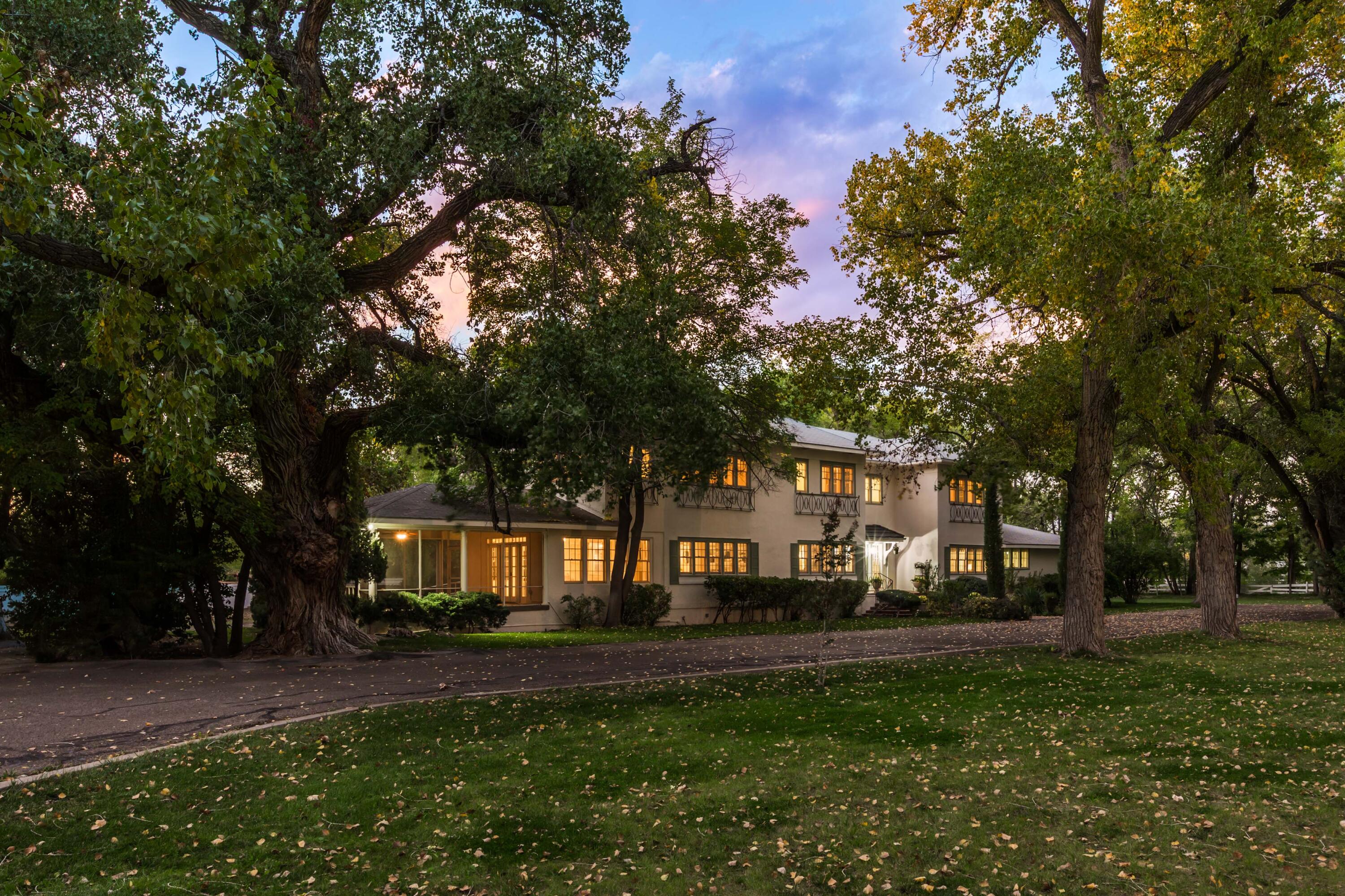 Iconic Dietz House -- offered for the first time in over 50 years. This grande dame of Rio Grande Boulevard showcases timeless classical architecture and sits prominently within a gated compound shaded by a canopy of cottonwood trees and surrounded by lush green lawns -- a setting rarely found in Albuquerque. Inside, exquisite period detailing includes rich hardwood floors, fine millwork, wood windows, a marble foyer, and a sweeping staircase that makes a stunning first impression. With 10 bedrooms and 7 baths, the home offers remarkable flexibility for a variety of lifestyles. Grand in scale yet inviting for everyday living -- an extraordinary opportunity to preserve its classic beauty or reimagine it into one of Albuquerque's most distinguished estates. Available with additional acreage.