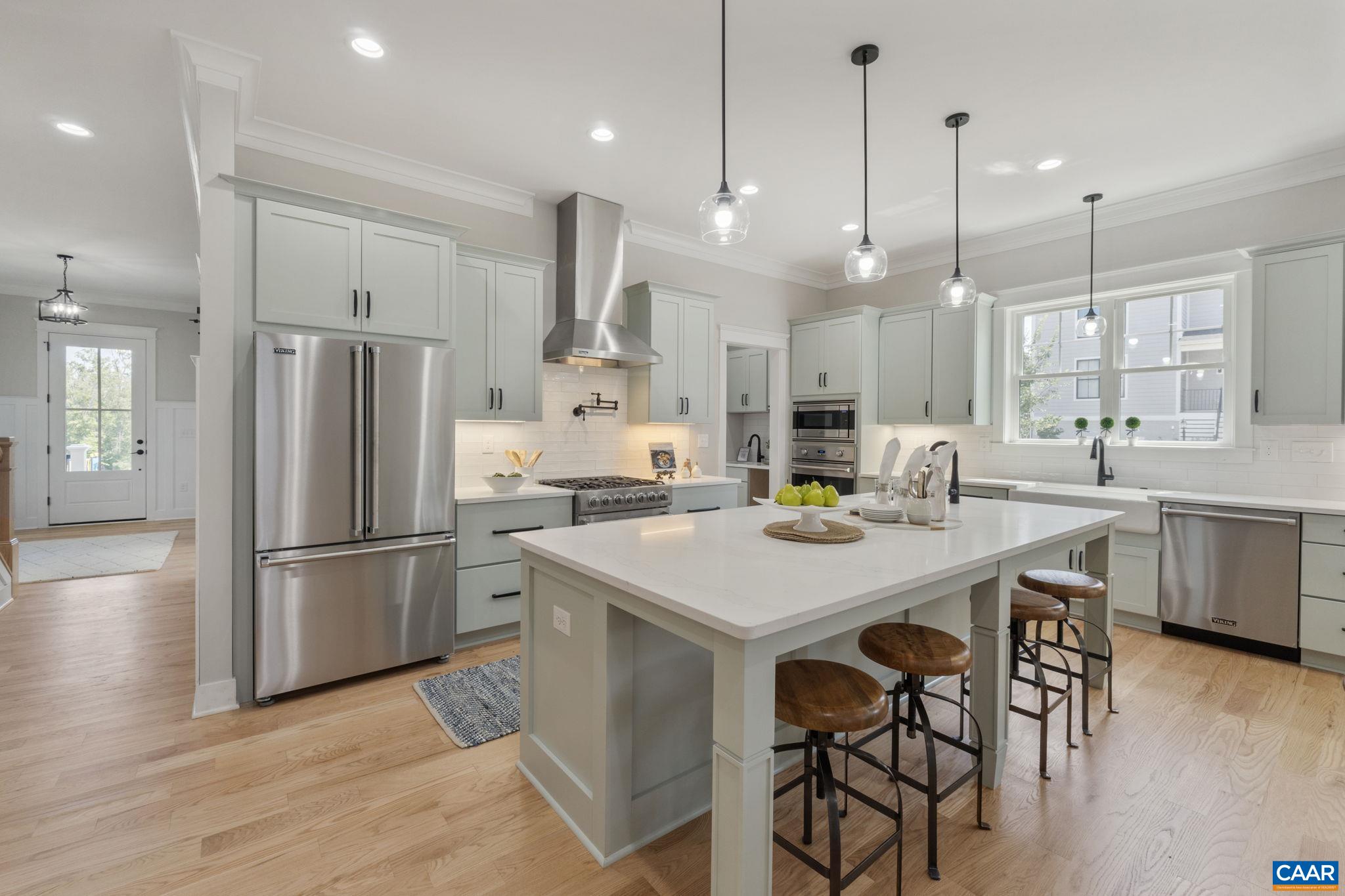 OPEN SUNDAY, Nov. 2, 1-3pm. Meet the builder! This custom built Belvedere stunner is Gibson Homes new construction and loaded with high end finishes. Finished in place hardwood floors w/ flush mount registers, solid core doors, Viking appliances, custom built-ins, solid closet shelving, 10 ft. ceilings on main level, coffered ceiling, and the list goes on... Sited on a corner lot, enjoy park and mountain views from one of the double stacked 10x16 decks. A chef's dream kitchen complete with an oversized pantry,  9 ft island, porcelain farm sink, prep sink and pot filler and a wet bar butler's pantry make entertaining a breeze. Delightful oversized stamped concrete patio! Thoughtful use of storage space and generously sized bedrooms. The walk up basement (with plumbing rough-ins and framing in place) offers so many possibilities for future expansion. The detached 2 car garage complete with an extra parking pad includes a finished carriage house above which can be rented or can be a perfect au pair suite, mother in-law apartment or private office. Owner/agent.