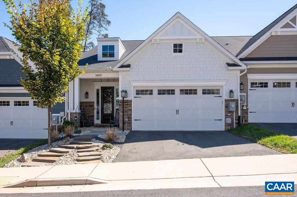 Tucked into one of the most private & peaceful locations in the Avinity community, this immaculate Villa offers the perfect blend of comfort, style & convenience. The gracious main level features 10’ ceilings, hardwood floors & easy-living open layout. Gorgeous kitchen w/ large granite island, abundant white cabinetry, tile backsplash, stainless steel appliances & gas range - flows beautifully into the dining area & living room. Step outside & enjoy the newly fenced & professionally landscaped private backyard. Impressive main-level primary suite w/ generous walk-in closet includes a luxurious bath w/ double sink vanity & oversized subway-tiled shower. Upstairs, you'll find two additional bedrooms, a full bath & versatile open loft - perfect for a second living area, office or playroom. Enjoy Avinity’s exceptional amenities, including a clubhouse, fitness center & dog park - all just minutes from downtown Charlottesville, I-64, schools & the shops & restaurants at 5th Street Station.