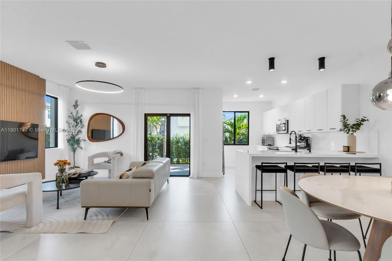 A Beautifully upgraded CG Skyview corner model in Urbana at Downtown Doral. This three-level home feels more like a trendy city loft than suburban living. The open layout is bright and modern, wrapped around a private courtyard that’s perfect for morning coffee or late-night hangs. Upstairs all 3 bedrooms have their own ensuite bath & custom closets (because clutter isn’t chic), and the top-floor loft brings the wow factor complete with built-in bar & two rooftop terraces with skyline views. You’ll have a two-car garage, impact glass, & resort-style amenities that make it hard to leave: pool, fitness center, basketball court, & more. Steps from parks, top schools, the restaurants of Main Street and CityPlace, this isn’t just a home — it’s a whole lifestyle in the heart of Downtown Doral!