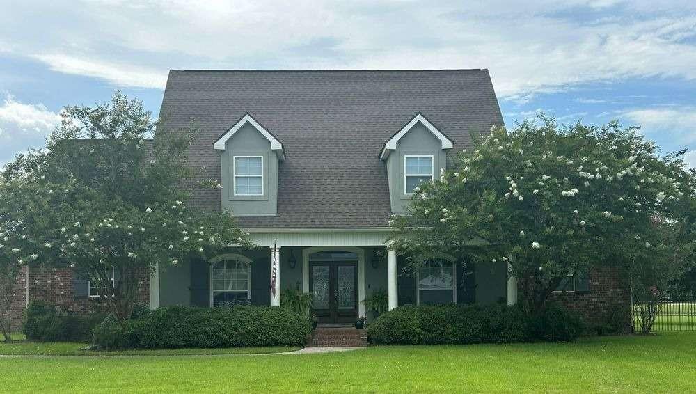 Welcome to Evangeline Estates, a custom-built home designed for luxurious living and entertaining. This custom-built 3-bedroom, 2 full and 2 half-bath home also includes a dedicated office that could serve as a 4th bedroom. Modern efficiency and reliability come standard with a 20KW whole-house generator, 24 solar panels, and two new Trane A/C units with gas heat. Spacious great room centered around a gas fireplace, a 75” screen TV, and a Bose sound system. The gourmet kitchen is newly renovated and features top-of-the-line appliances — including a GE Monogram 36" gas range, GE Monogram 5-in-1 wall oven, KitchenAid dishwasher, and under-counter ice maker and 3CM granite countertops. The property also includes a 25x25 attached 2-car garage, a 24x18 detached garage/workshop, and additional awnings for boat/ATV storage. The primary suite offers dual walk-in closets, a Jacuzzi whirlpool tub, and a walk-in shower. Upstairs, you’ll find two generous bedrooms with dormer spaces.