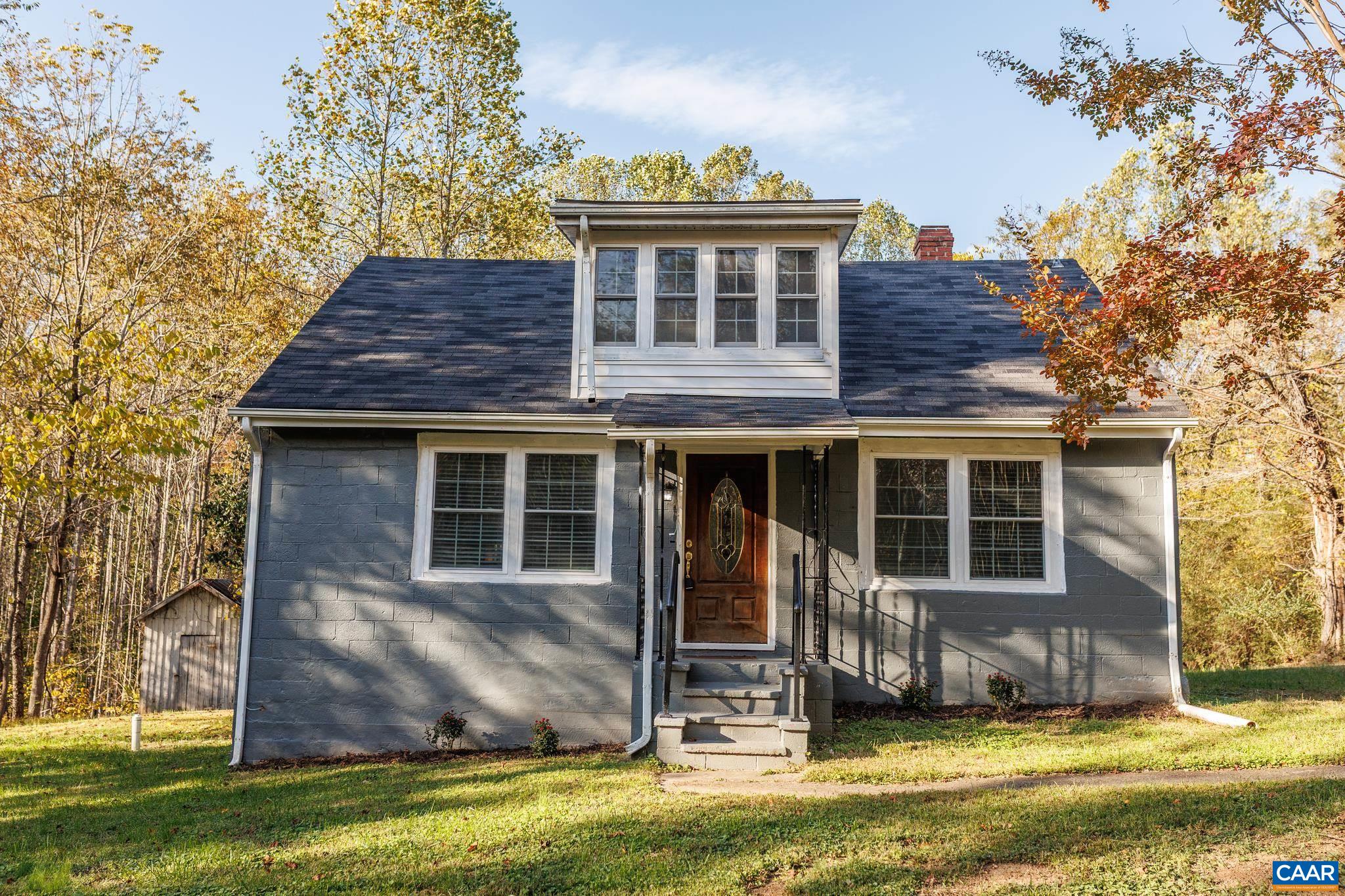 Tucked away in a peaceful setting, this beautifully remodeled Cape Cod home offers the perfect blend of charm and modern comfort. Featuring 3 bedrooms and 2 full baths, this home is move-in ready and full of thoughtful updates throughout. Step inside to an inviting layout with updated finishes, fresh paint, and original hardwood flooring. The first-floor primary bedroom includes a gorgeous en suite bath, creating a private retreat for relaxation. Upstairs, you’ll find two additional bedrooms ideal for family, guests, or a home office. Relax in the morning and evenings on your screened in porch. The unfinished basement provides plenty of potential for expansion, storage, or a future recreation space. Surrounded by trees and tranquility, this home offers a sense of privacy while still being conveniently located to the Town of Scottsville only 10 mins away and 20 mins to Charlottesville. 2 Additional parcels available for sale surrounding the home.