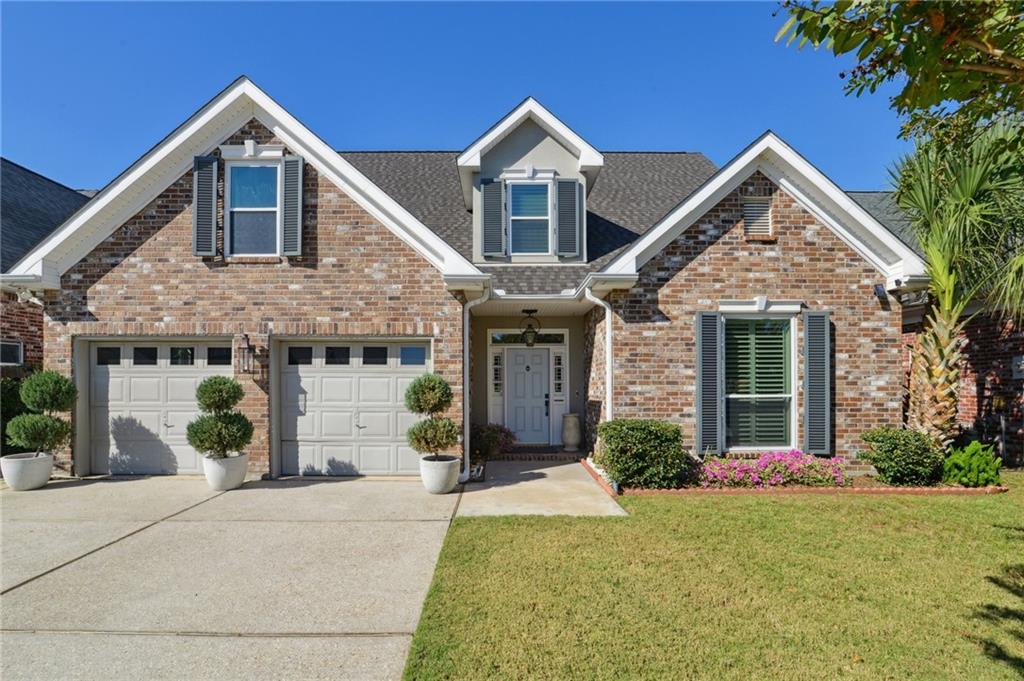 **FIRST SHOWING AT OPEN HOUSE: TUESDAY, NOVEMBER 4TH, 11:00AM–1:00PM**
Welcome home to this beautifully updated and meticulously maintained residence on a quiet, family-friendly street surrounded by newer homes. Thoughtfully designed for comfort, convenience, and peace of mind, this home offers both modern style and exceptional functionality.

Inside, you’ll find 4 spacious bedrooms plus a dedicated office or flex room, providing plenty of space for work, play, and everyday living. The bright living room features a striking two-story cathedral ceiling, cozy fireplace, and built-in bar—perfect for gatherings with family and friends. The primary suite is conveniently located on the main floor and features a beautifully updated bath for privacy and ease.

The chef’s kitchen is a true highlight, featuring granite counters, a gas stove and. high-end appliances. It flows seamlessly into a separate breakfast room for casual dining and a formal dining room for hosting special occasions.

Enjoy peaceful moments in the sunroom, an ideal spot for morning coffee or birdwatching, or step outside to the outdoor patio with an adjustable louvered roof system, designed for rain, shade or shine and year-round enjoyment.

Built for long-term comfort and security, this home features updated windows, hurricane shutters, a whole-home generator, and a Post-Ida roof with transferable warranty. The detached workshop/shed with AC and an overhead door is perfect for hobbies or extra storage. Additional highlights include beautiful plantation shutters throughout the home, a two-car garage with AC/heat, and X-zone flood for added peace of mind.

With its thoughtful updates, flexible layout, storage galore and inviting spaces inside and out, this move-in-ready home is perfectly suited for family living. Don’t miss your chance to call it home!