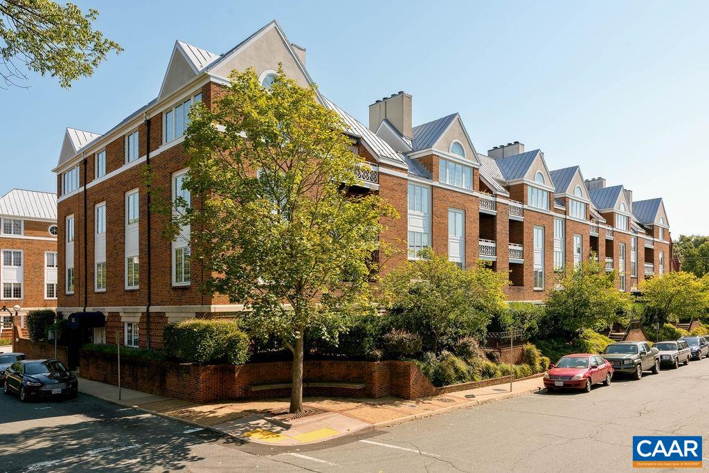 Enjoy everything Downtown Charlottesville has to offer from this prime location on East Jefferson Street only 2 blocks from the Downtown Mall with restaurants, theaters, art openings, and open air concerts all within walking distance. From the balcony you have a panoramic view of historic downtown buildings, churches, and homes and Market Street Park. Renovated interior has hardwood floors, updated kitchen and baths, stainless appliances and quartz counters. Full size kitchen has plenty of counter and cabinet space, a nice pantry, and room for a breakfast table. Open floor plan makes the living area feel spacious. South facing windows and balcony let in lots of sunshine into this upper floor unit. Full size washer and dryer in the hall laundry room convey. Enjoy the safety of a secured building and a covered parking space reserved for you in the ground floor garage. Take the stairs for exercise or use the elevator. Each unit has a generously sized, locked storage area in the basement for sports equipment or suitcases or seasonal items, etc.  Condo fee covers water/sewer, gas service for the FP along with all maintenance of the building, exterior grounds, & interior common spaces. Both Ting & Xfinity high speed internet available.