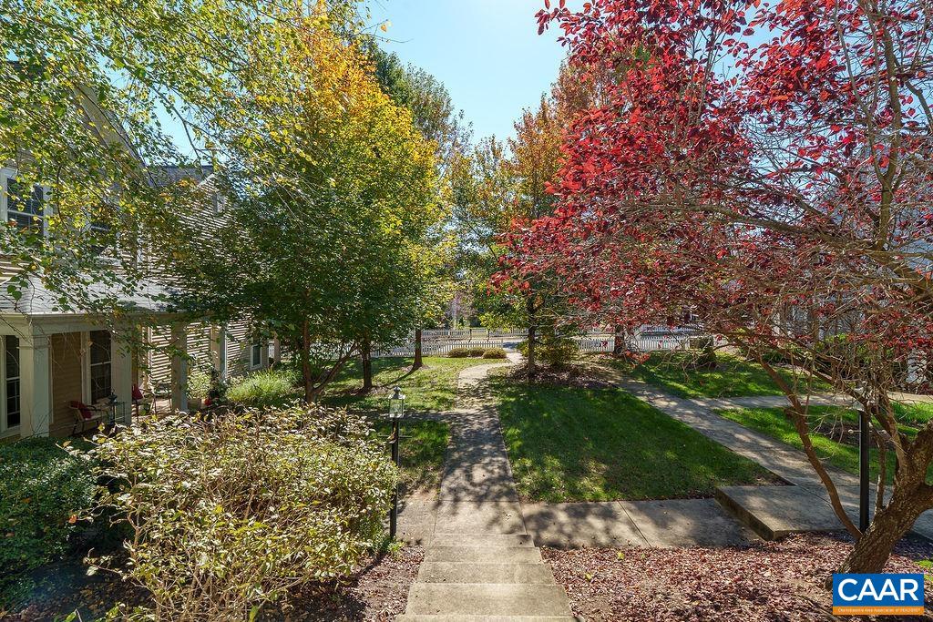 Convenient living at its finest! This light-filled, 3 bedroom, 2.5 bathroom, attached home is nestled at the edge of a cozy courtyard community and walking distance from the restaurants and coffee shops of Crozet. The main level features a kitchen, living area, primary bedroom with private bathroom, and guest bathroom - all with beautiful hardwood floors. Upstairs includes two more bedrooms, a full bathroom, and a bonus room which is ideal as an office, study, or crafting space. The HOA conveniently maintains the exterior. Only 20 minutes to UVA, 25 minutes to the Downtown Mall, 30 minutes to the airport & NGIC.