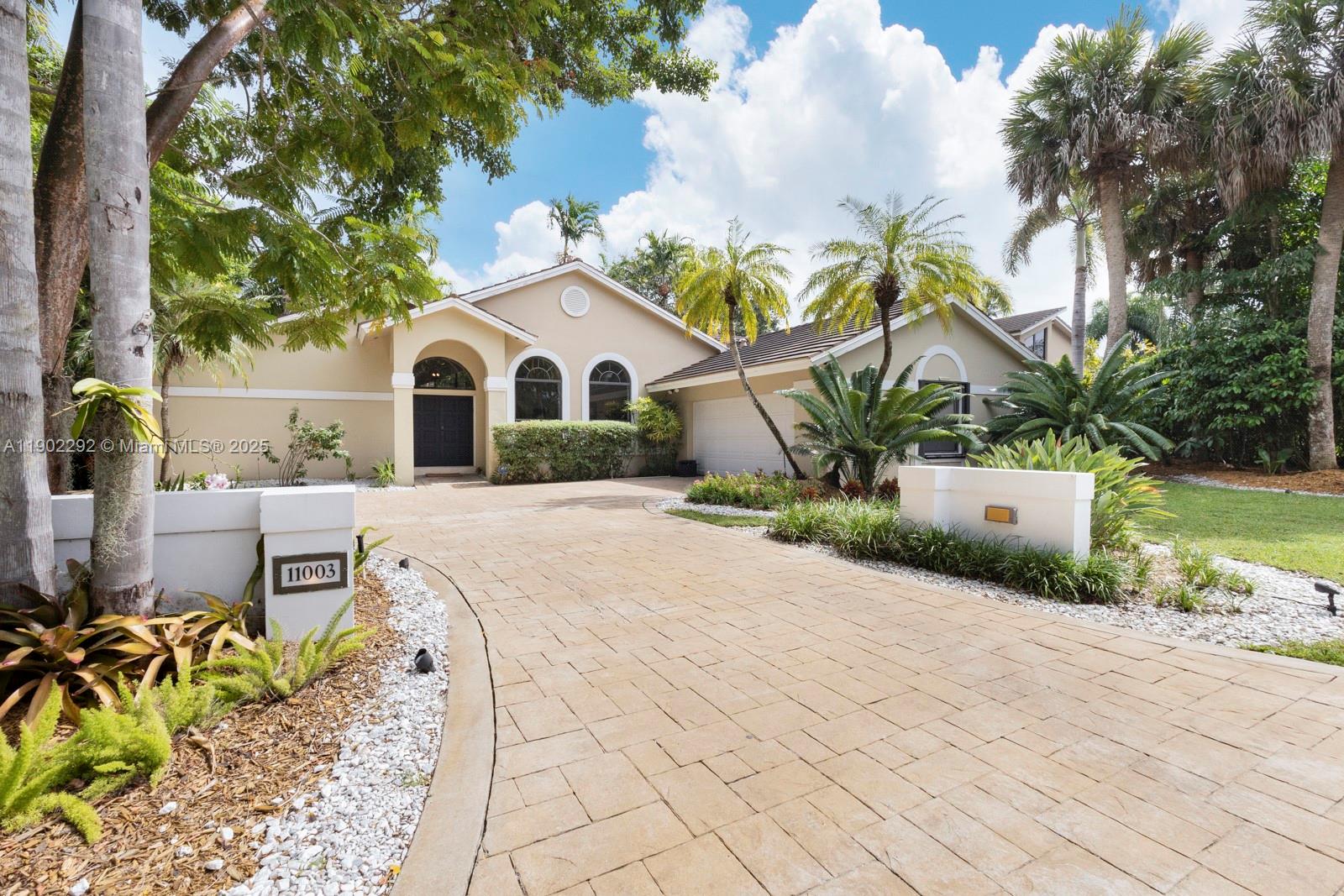 Beautiful single family home on the biggest lot (20.055 sqft) in North Pinecrest's gated community of Arabesque.  1990 Hollub-built 4/2.5 split plan with soaring high ceilings and open living spaces.  Huge primary suite includes a separate office or sitting room with tons of closet space and a large bathroom.  Marble floors, indoor laundry and impact glass windows on front side.  Original patio terrace enclosed for extra living space, lushly and gorgeously landscaped yard, built-in BBQ grill, and plenty of room to build a pool.  Ideally located in the best part of Pinecrest with access to the best Pinecrest schools (Palmetto elementary, Palmetto middle, and Palmetto Senior High) and all points north.