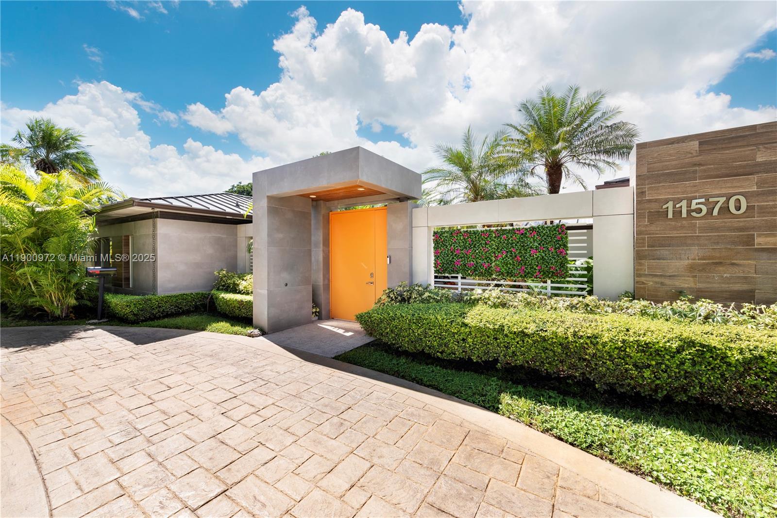 Hidden behind a lush private atrium, this 5BD/4.5BA residence lives like a private retreat. The entry sets a tranquil tone—an open-air enclave that adds privacy and a peaceful sense of arrival. Inside, light and greenery fill every space, where wood-clad ceilings, glass doors, and natural textures create relaxed sophistication.

The show-stopping primary suite is a true sanctuary, rarely found in this price category—nearly two rooms in one, with a lounge area, private pool access, and a spa-inspired bath. On the opposite side, four generous bedrooms, two ensuite, offer comfort and privacy.

Tall privacy hedges surround the pool, creating a serene escape with spaces to dine, lounge, or unwind. Homes of this character are seldom available—come experience it for yourself.