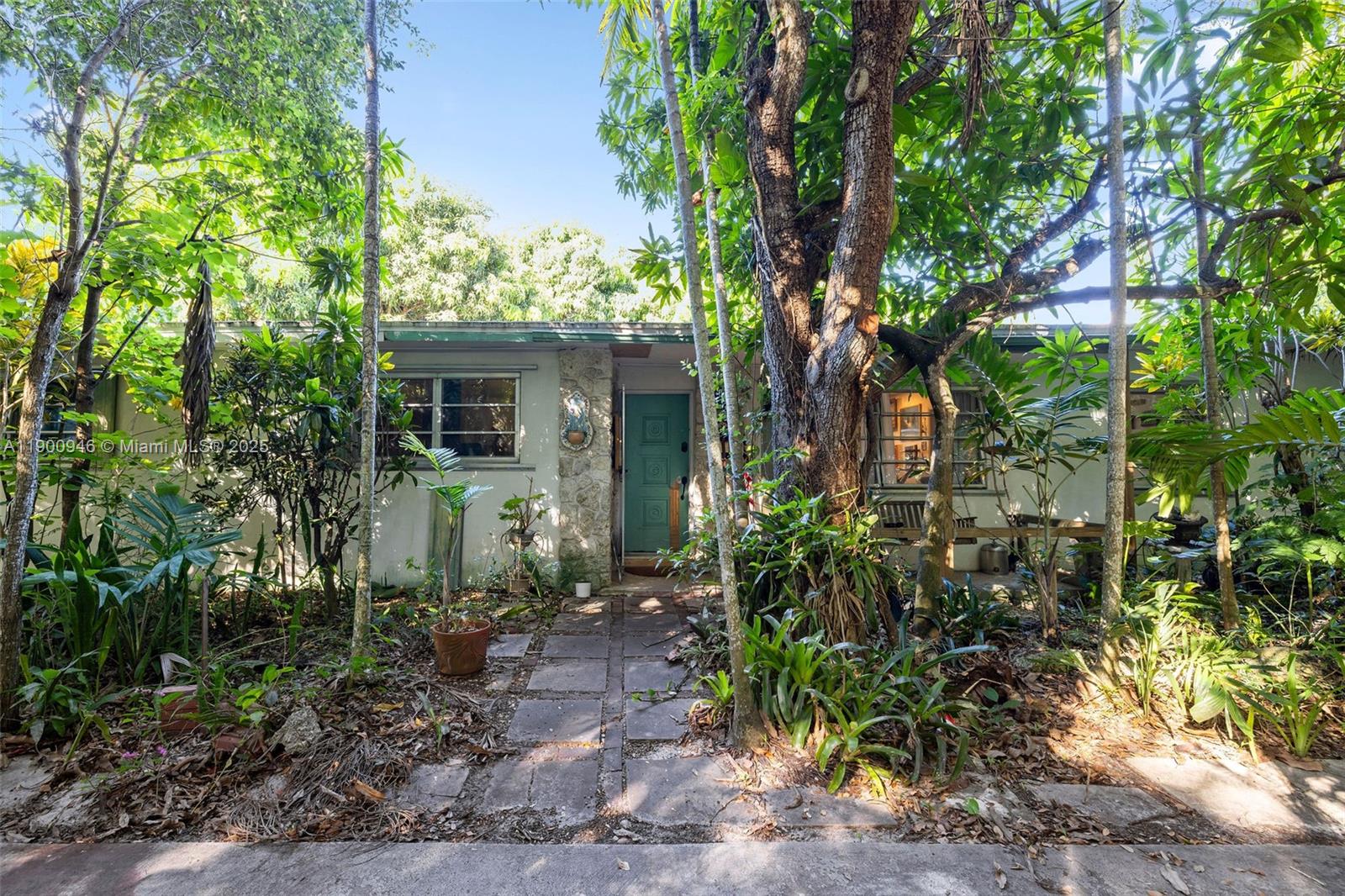 In the heart of Palmetto Bay, this half acre lot holds true potential. Surrounded in a fruit tree oasis, holds a home with a lot of character, charm, and history. Walking distance to Coral Reef park, this property is perfect for a family with kids to create their dream home.