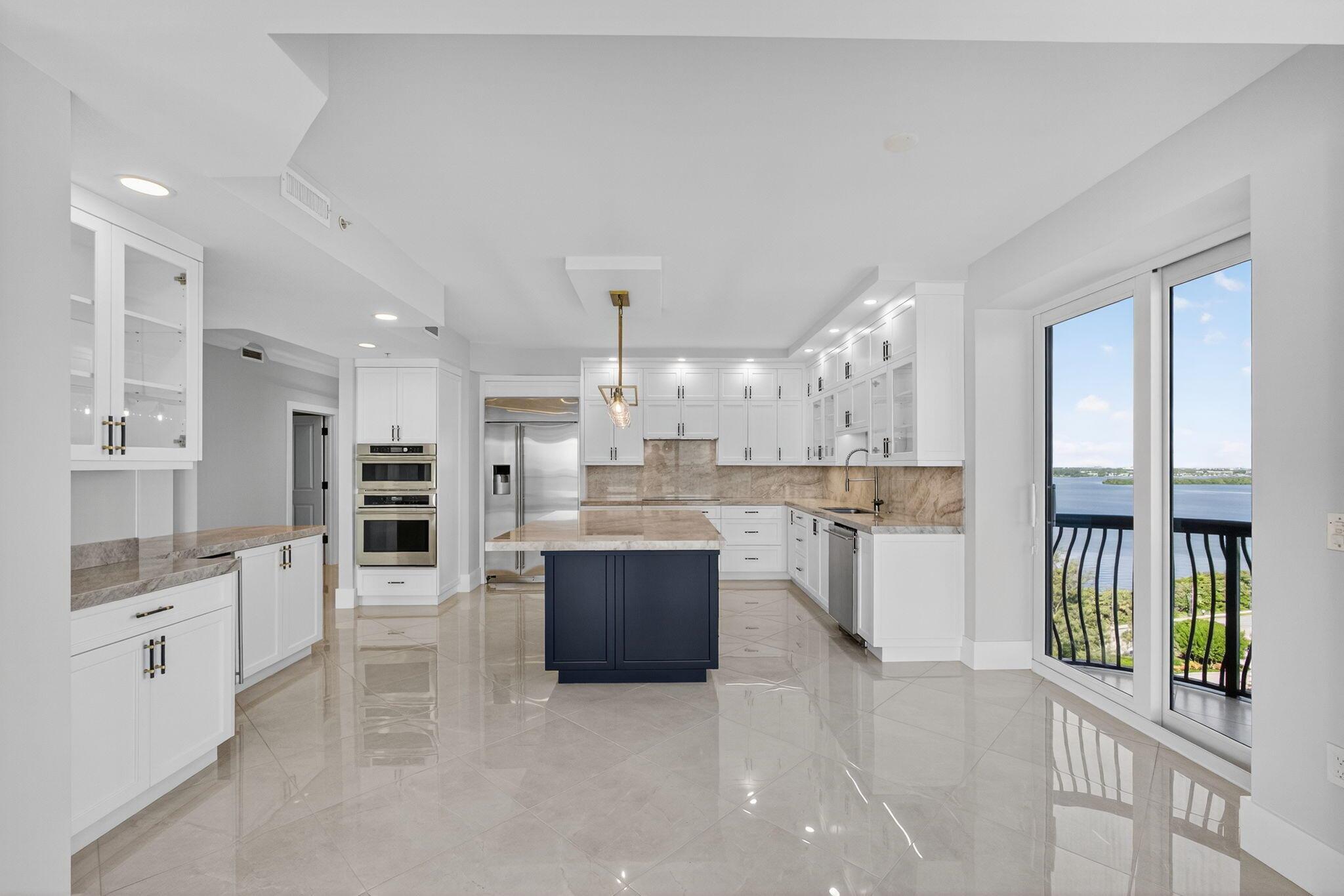 Experience luxury coastal living in this newly fully renovated beachfront residence with both panoramic ocean and Intracoastal views from two expansive balconies. The chef's kitchen features solid wood cabinetry, marble/cristallo countertops and backsplash, large island, vented oven hood and GE Monogram appliances. The elegant owner's suite includes ocean views, 3 custom built out closets, blackout shades, balcony access, & new spa-like bath with marble finishes, soaking tub, and ocean-view shower. Guest suites offer ensuite baths, walk-in closets, and private balcony. Impact glass throughout. AC 2023. Via Delfino is a boutique high-rise with a heated pool, spa, gym, dog park, and 350 ft of private beach. Recent updates: new roof (2023), remodeled lobby (2021), and renovated gym (2023)