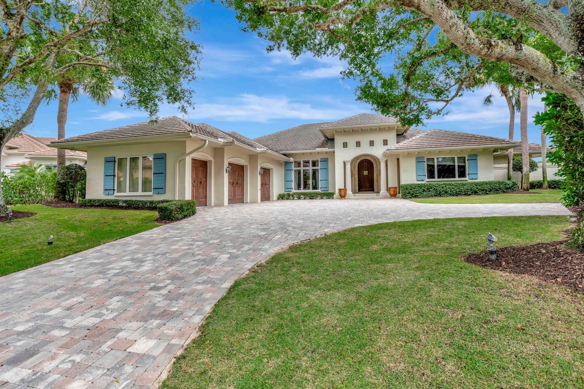Welcome to one of the most coveted addresses in The Loxahatchee Club. Perfectly positioned at the end of a quiet cul-de-sac, this exceptional point lot offers some of the most spectacular golf and water views in the entire community. With sweeping vistas in every direction, this property represents a truly rare opportunity. The existing residence is move-in ready, offering comfortable living from day one -- yet it also serves as the perfect canvas for a major renovation or an extraordinary new build. Premier lots of this caliber are few and far between. Beyond the property, residents of The Loxahatchee Club enjoy world-class amenities including 18 holes of championship golf on a Jack Nicklaus Signature course with a renowned caddie program, a newly renovated clubhouse designed in classic British West Indies style, a state-of-the-art fitness center, spa, tennis courts, and exceptional dining.
This is timeless, understated elegance at its best &#x14; and an opportunity to own one of the finest locations within Jupiter's best-kept secret.