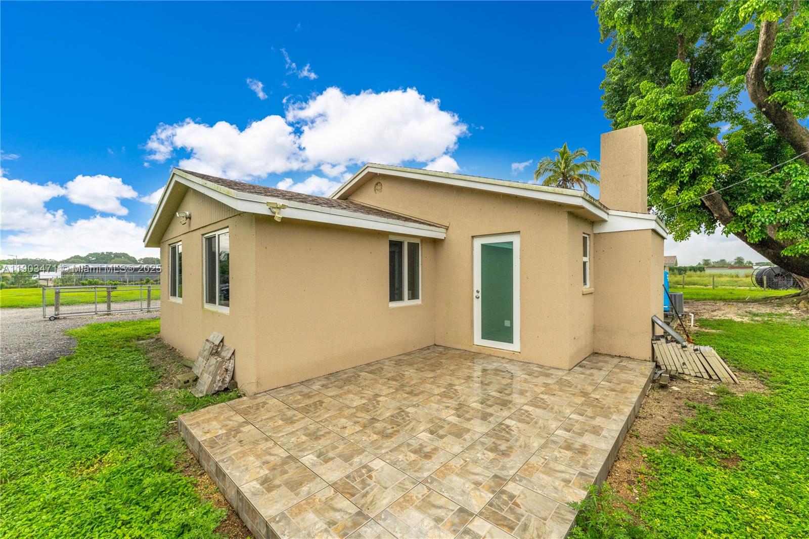 The Redlands are calling you with this little big farm. Located just west of the fruit and spice park on 248st this property features a 3/1 house that was 100% renovated inside and out. The east 2.5 acres of the property is planted with longan trees and features a new state of the art irrigation system. This property is a plug and play property, just move in and start living. The only thing missing is you.