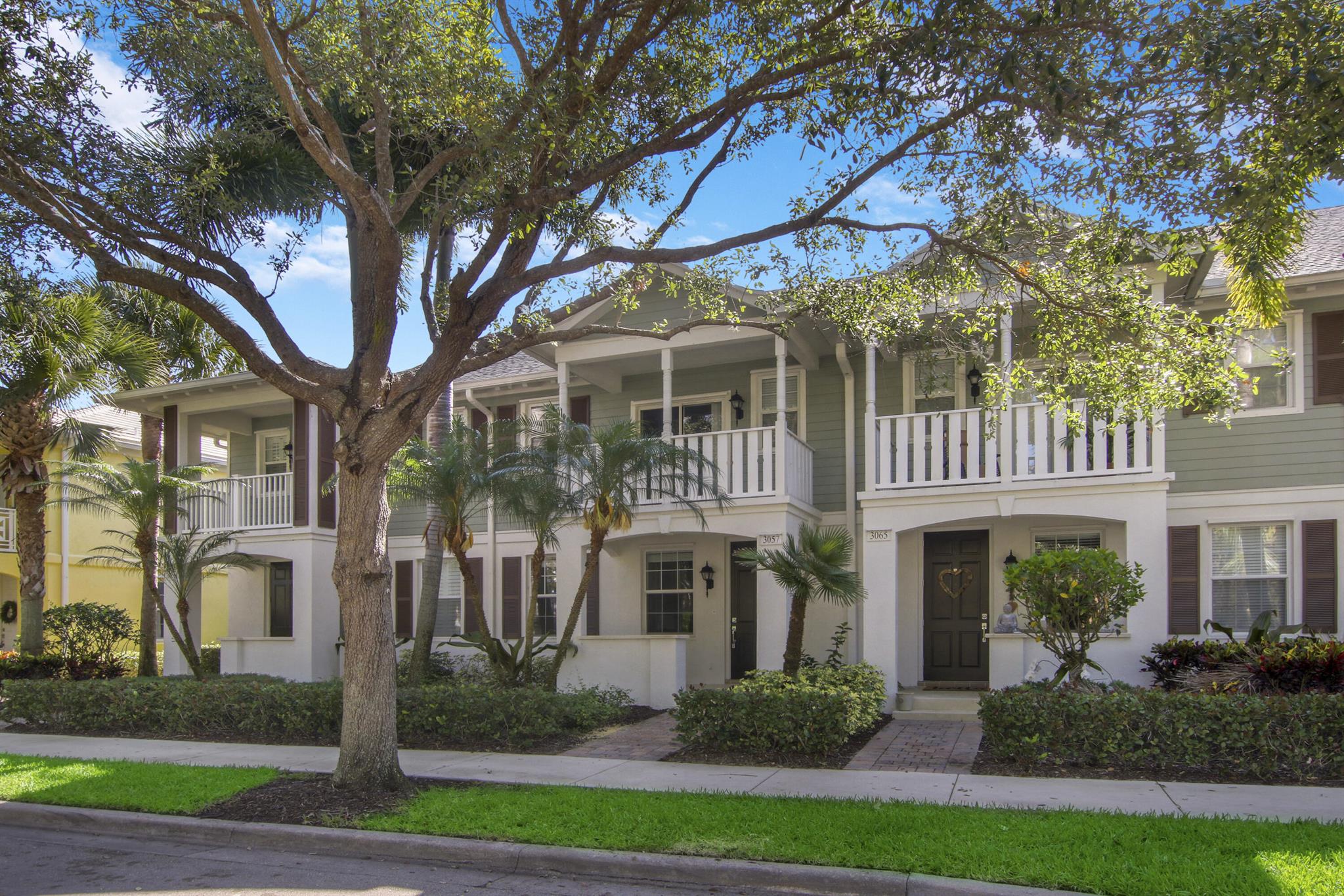 Beautiful Divosta Built 3 bedroom 2 1/2 bath 1 car garage (plus full driveway) townhouse in the lovely neighborhood of Martinique at Abacoa. This luxury townhome includes granite kitchen countertops, stainless steel appliances, full size washer and dryer, tile and luxury vinyl flooring (which replaced laminate seen in photos) on the main level, newer carpeting on the stairs and second level, 3 second level bedrooms including a spacious master suite and bath with dual sinks and a separate shower, separate tub and walk in closet. Also included are hurricane protection panels, a covered front porch and covered balcony. The   HOA fee includes basic cable, high speed internet, lawn care and sprinklers. Recreational facilities include a community swimming pool.......